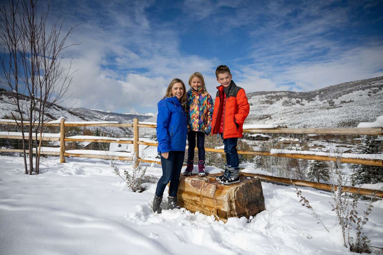 Anna Robertson, co-founder of The Cool Down, poses for a photo with her children, Sibella Wildman, 7, and Jackson Wildman, 8, at their home in Park City on Thursday. The Cool Down is described by its founders as the first mainstream climate brand on a mission to connect a wide-ranging audience to climate topics and conversations.