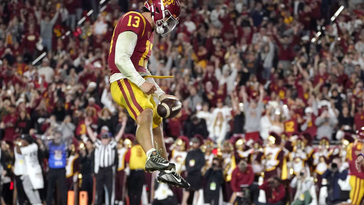 Southern California quarterback Caleb Williams celebrates after running in for a touchdown during the first half of an NCAA college football game against Notre Dame Saturday, Nov. 26, 2022, in Los Angeles.