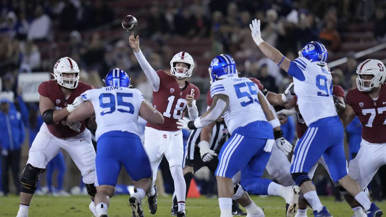 Stanford quarterback Tanner McKee (18) throws a pass against BYU during the first half of an NCAA college football game in Stanford, Calif., Saturday, Nov. 26, 2022.