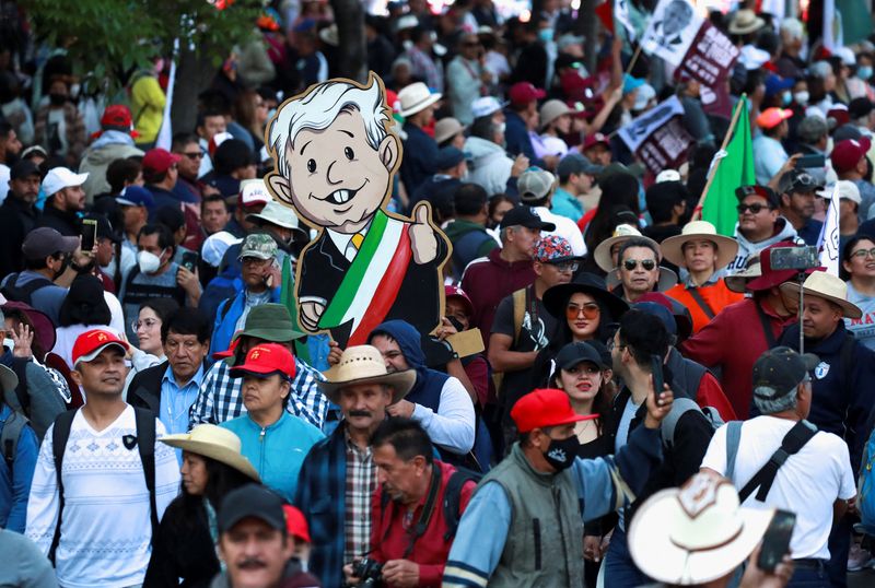 People take part in a march in support of Mexican President Andres Manuel Lopez Obrador's government policies and to celebrate his four years in the office, in Mexico City, Mexico.