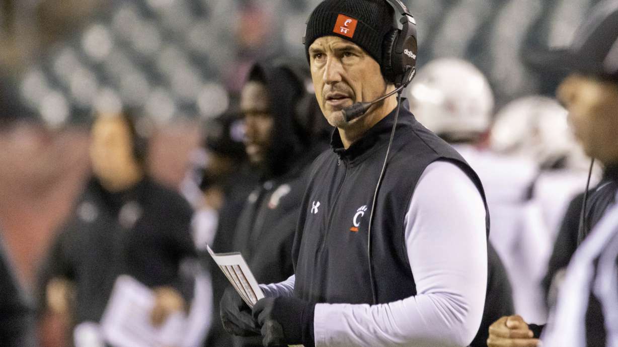 Cincinnati head coach Luke Fickell looks on in the first half of an NCAA college football game against Temple, Saturday, Nov. 19, 2022, in Philadelphia.
