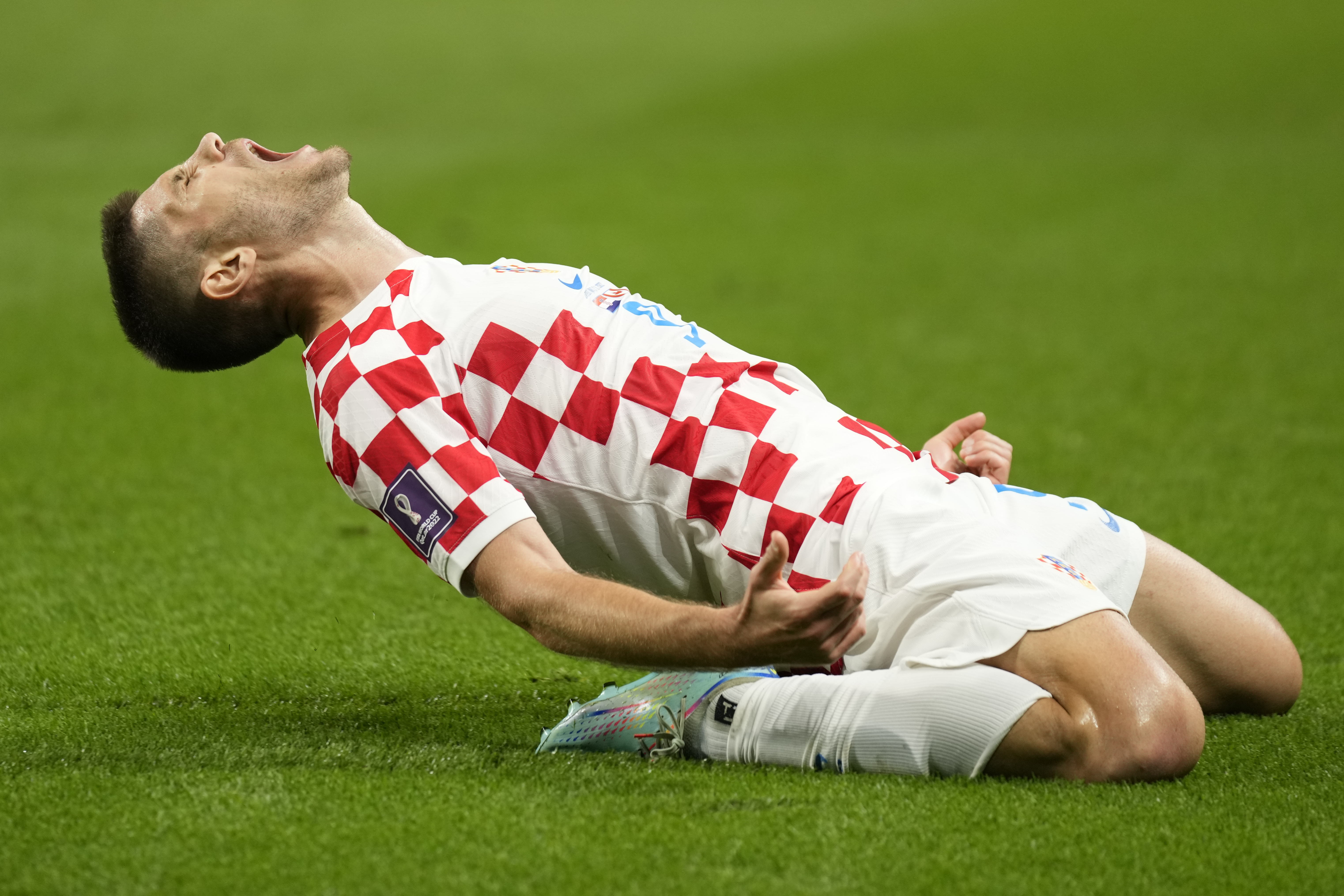 Croatia's Andrej Kramaric celebrates after scoring his side's opening goal during the World Cup group F soccer match between Croatia and Canada, at the Khalifa International Stadium in Doha, Qatar, Sunday, Nov. 27, 2022. 