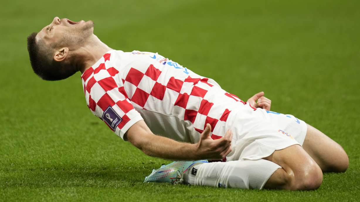 Croatia's Andrej Kramaric celebrates after scoring his side's opening goal during the World Cup group F soccer match between Croatia and Canada, at the Khalifa International Stadium in Doha, Qatar, Sunday, Nov. 27, 2022.
