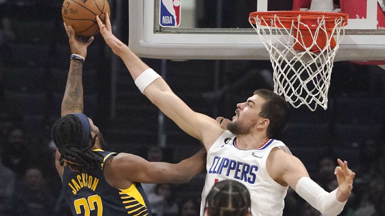 Indiana Pacers forward Isaiah Jackson, left, has his shot blocked by Los Angeles Clippers center Ivica Zubac during the first half of an NBA basketball game Sunday, Nov. 27, 2022, in Los Angeles.