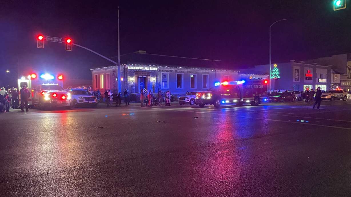 A horse and rider were hit by a car that was driven through barricades during a light parade on Friday night in Spanish Fork.