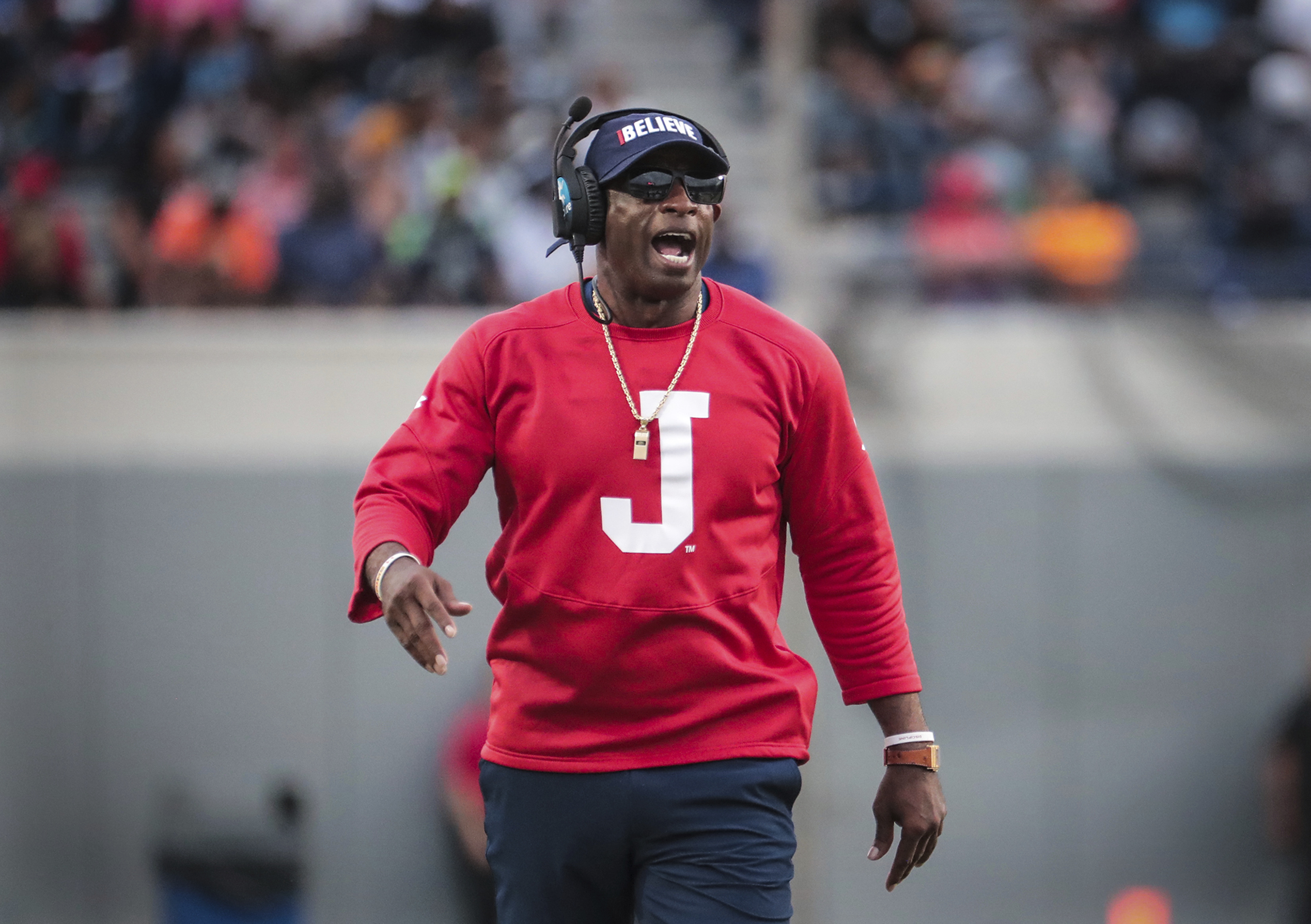 FILE - Jackson State coach Deion Sanders gets his team's attention during the Southern Heritage Classic NCAA college football game against Tennessee State, Saturday, Sept. 10, 2022. Deion Sanders confirmed Monday, Nov. 28, the University of Colorado is among multiple head coaching jobs he’s been offered.
