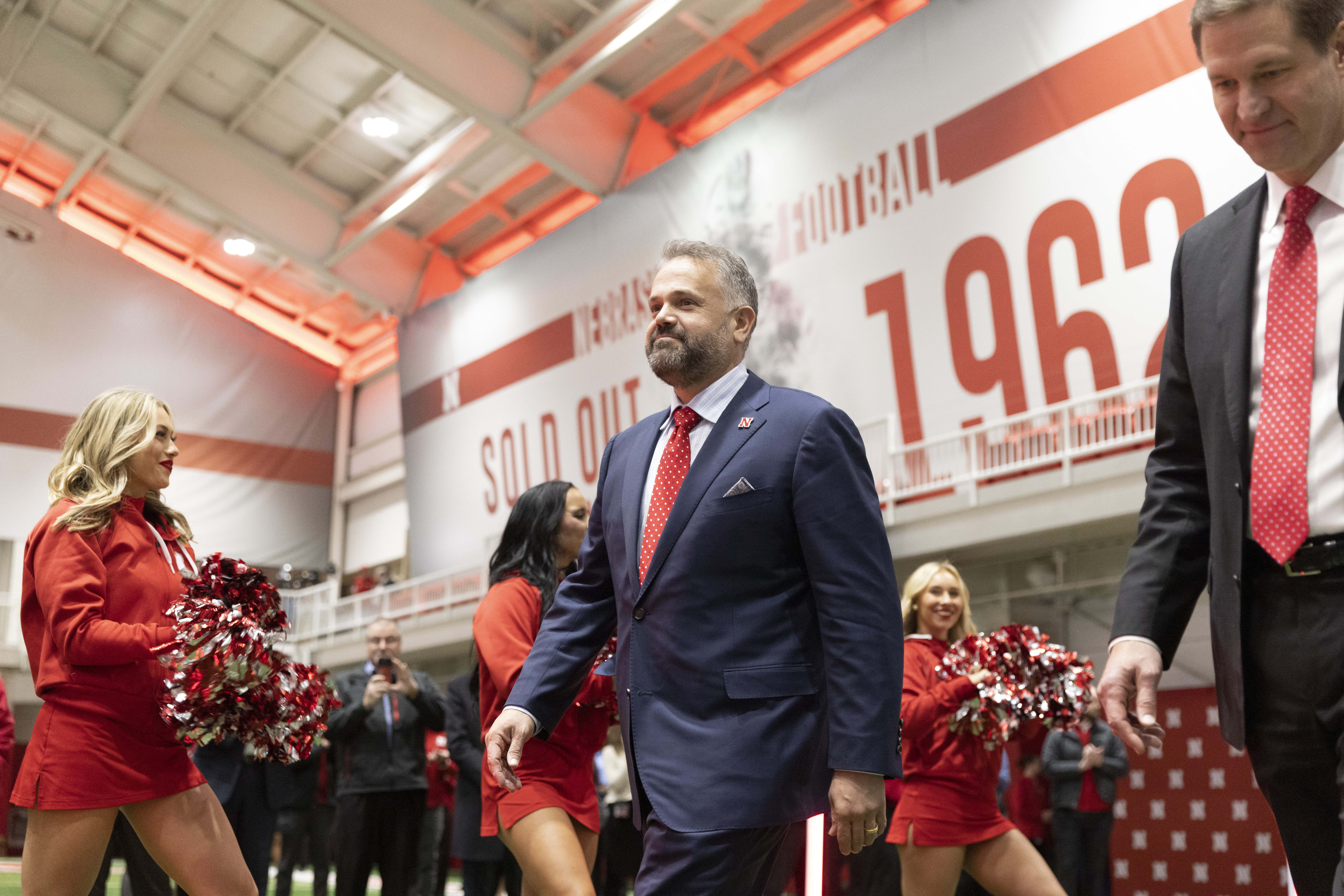 New Nebraska NCAA college football coach Matt Rhule, left, arrives with athletic director Trev Alberts for an introductory press conference, Monday, Nov. 28, 2022, in Lincoln, Neb. 