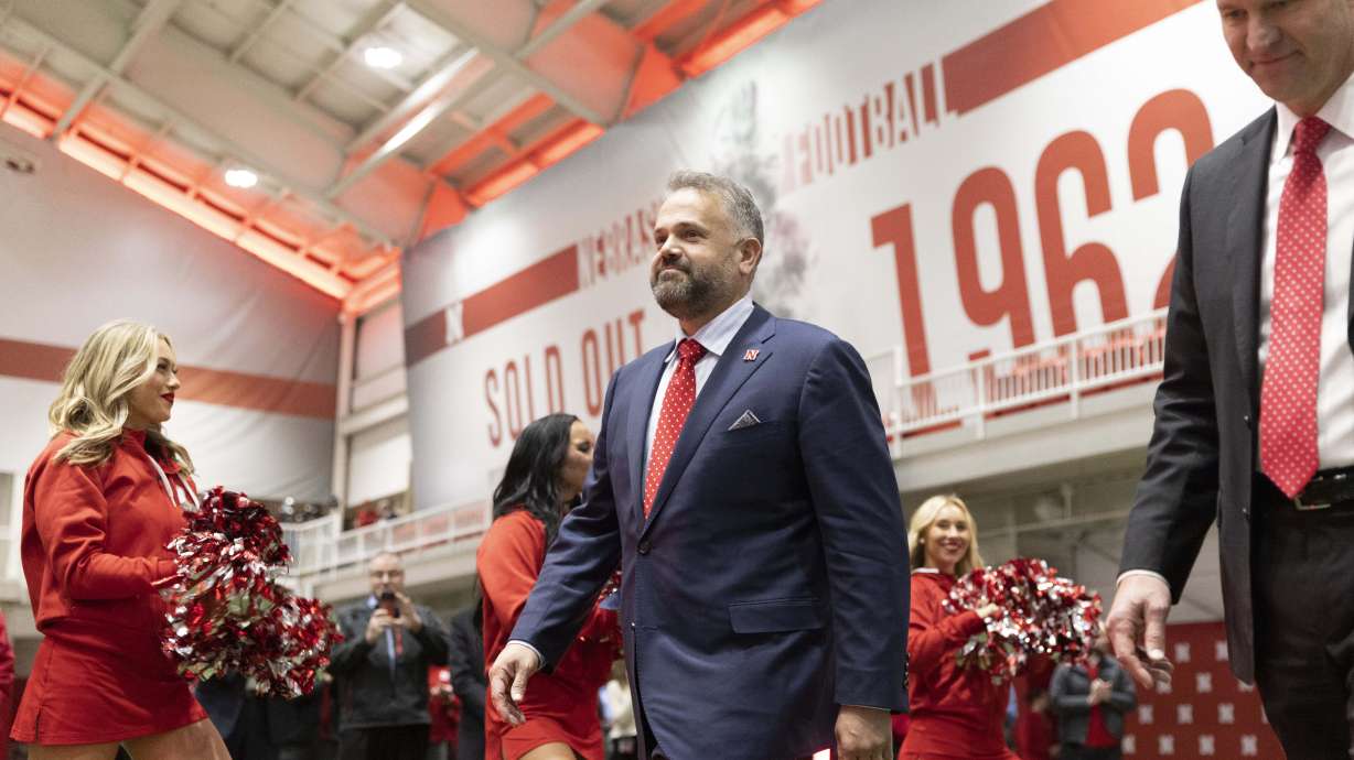 New Nebraska NCAA college football coach Matt Rhule, left, arrives with athletic director Trev Alberts for an introductory press conference, Monday, Nov. 28, 2022, in Lincoln, Neb.