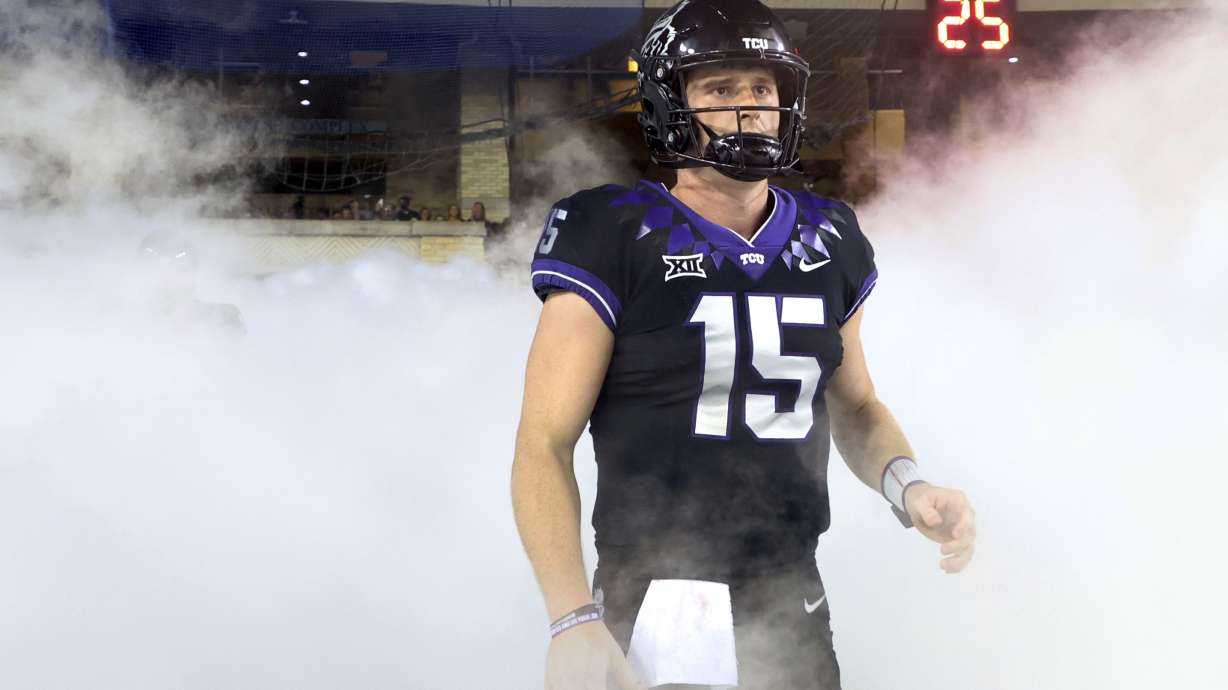 FILE - TCU quarterback Max Duggan (15) stands at a tunnel exit during team introductions before an NCAA college football game against Kansas State in Fort Worth, Texas, on Oct. 22, 2022. Duggan’s 41st career start for third-ranked TCU will come in the Big 12 championship game on Saturday, Dec, 3, 2022, with the undefeated Horned Frogs on the brink of making the College Football Playoff.