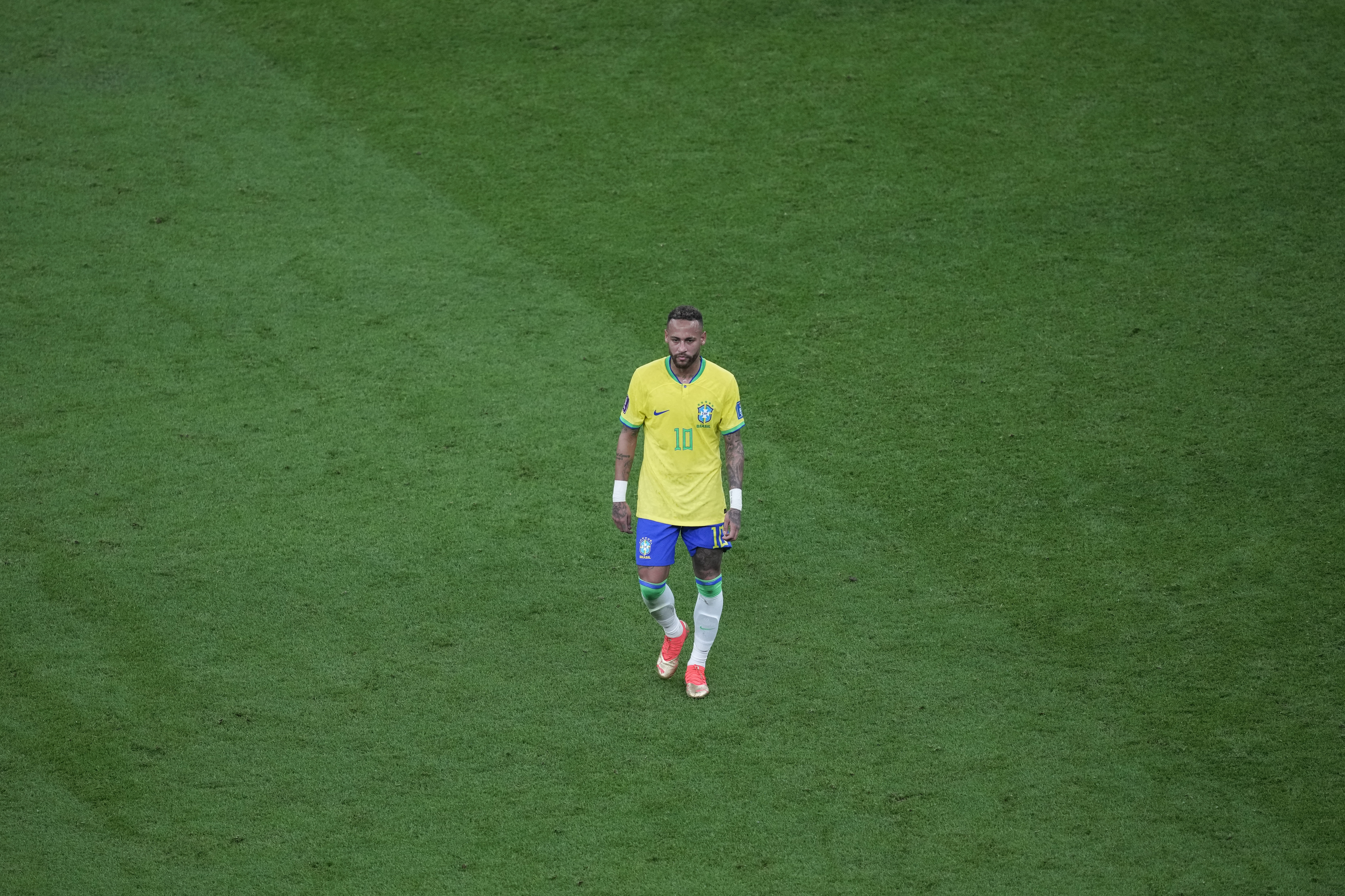 Brazil's Neymar walks on the pitch during the World Cup group G soccer match between Brazil and Serbia, at the the Lusail Stadium in Lusail, Qatar on Thursday, Nov. 24, 2022. 