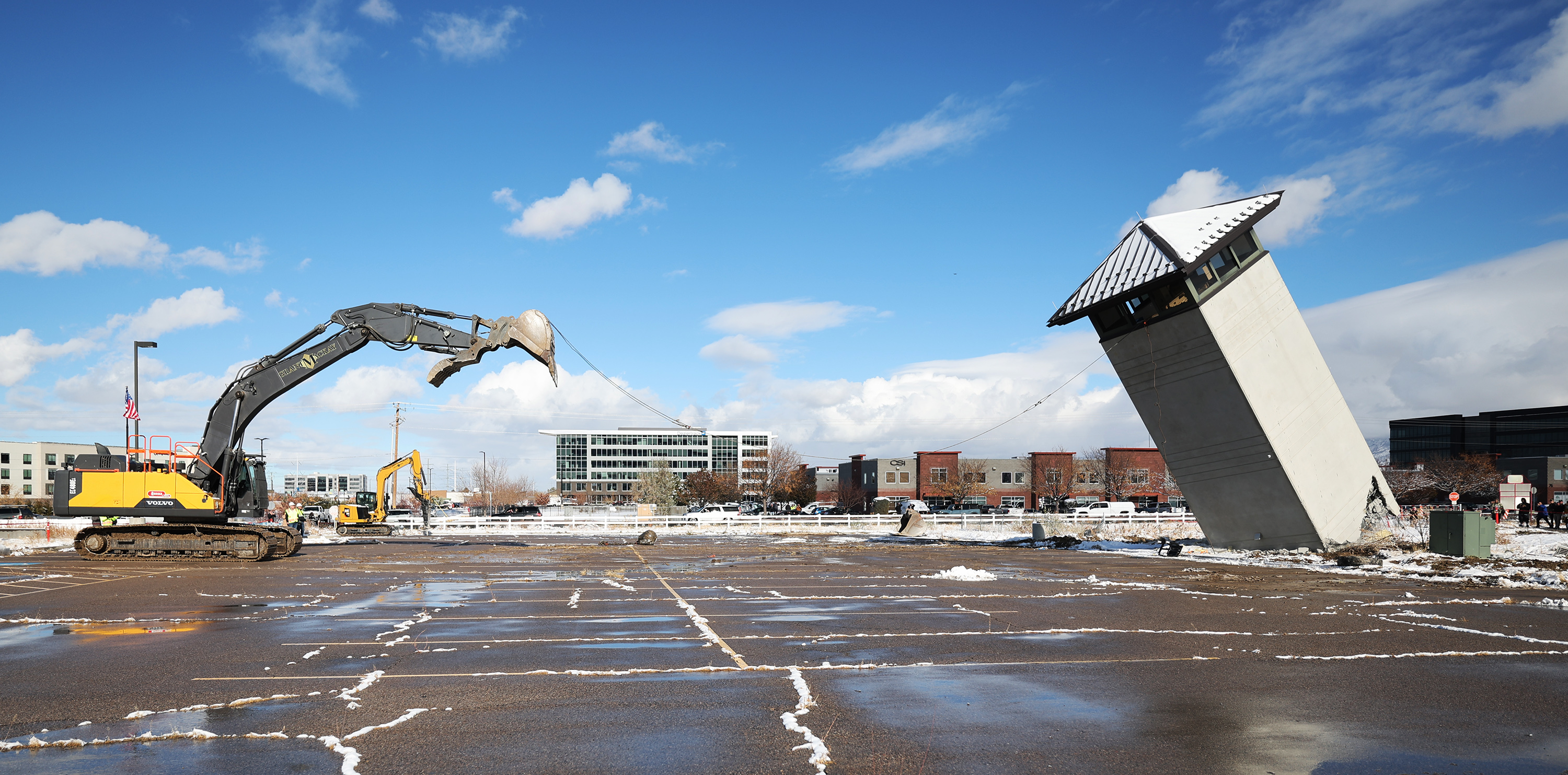 A guard tower begins to fall at the old Utah State Prison in Draper on Tuesday. Demolition of the old Utah State Prison began with the ceremonial tearing down of the decades-old guard tower. What comes next is the construction of a 600-acre development called The Point.