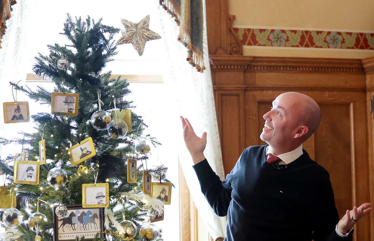 Gov. Spencer Cox reacts to a crooked star he put on a Christmas tree decorated by Middle Elementary students at the Governor’s Mansion in Salt Lake City on Tuesday. The students called it a shooting star.