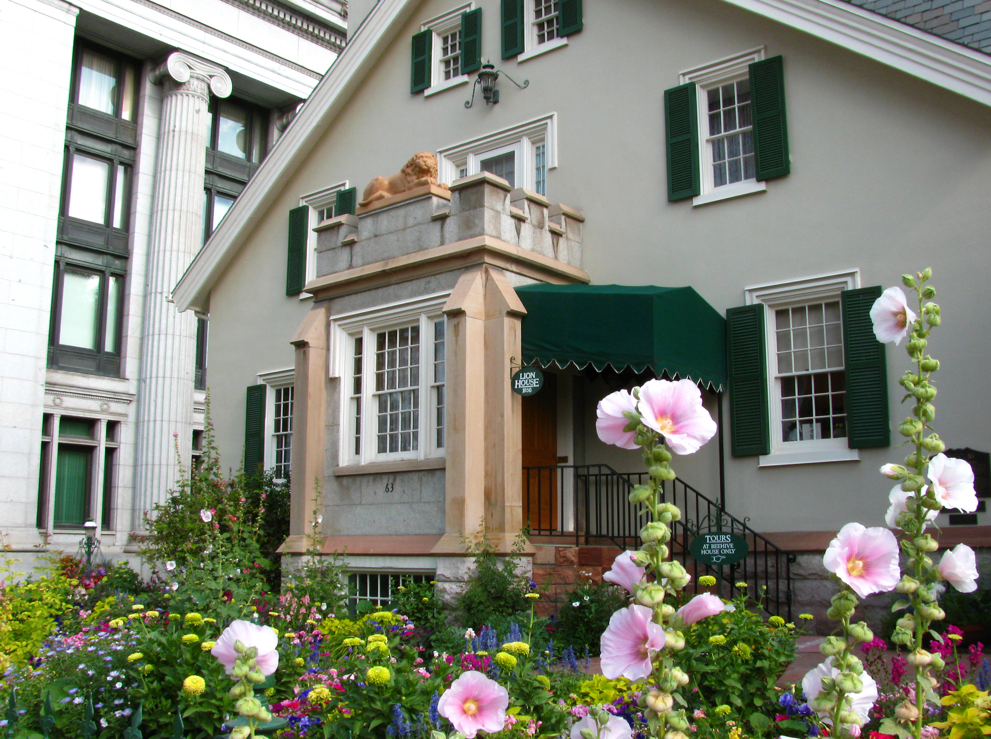 An undated photo of the exterior of the Lion House in Salt Lake City. The house's name comes from the lion statue pictured here, which was sculpted by William Ward.