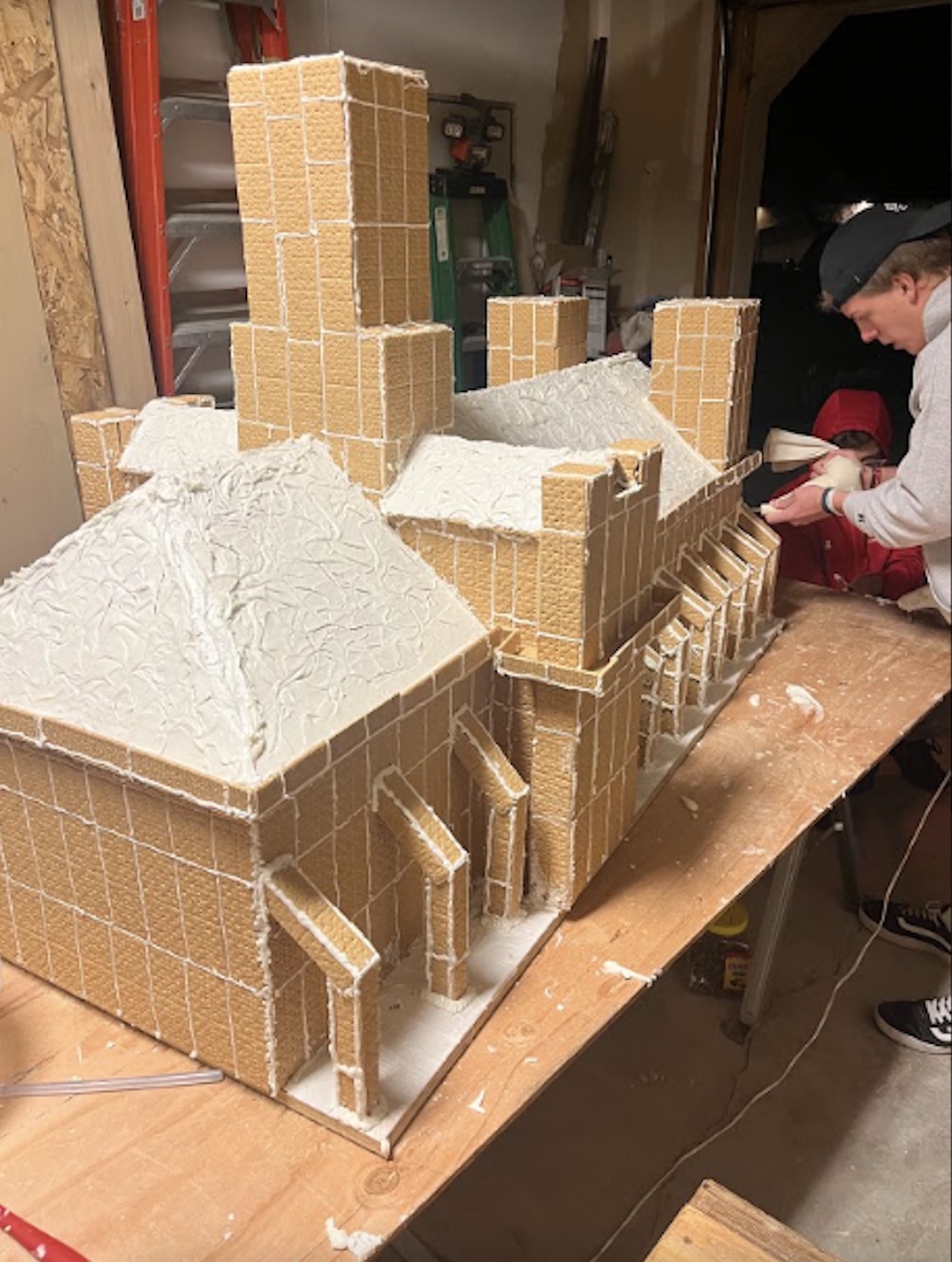 Three teens at Bingham High School made an especially festive gingerbread creation, of towering proportions.