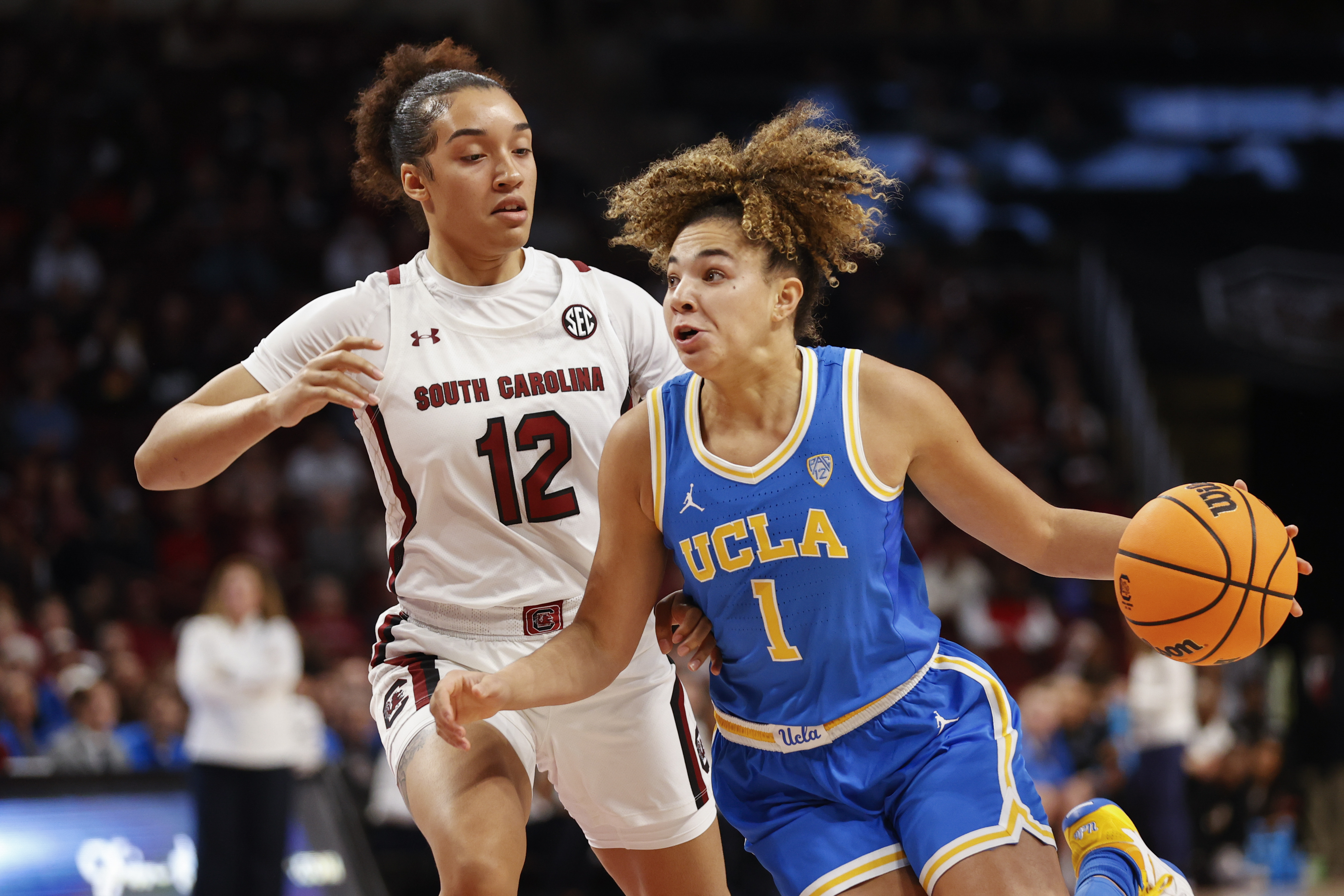 UCLA guard Kiki Rice (1) drives to the basket against South Carolina guard Brea Beal (12) during the first half of an NCAA college basketball game in Columbia, S.C., Tuesday, Nov. 29, 2022.