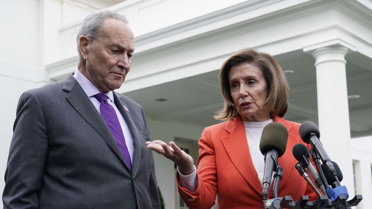 Senate Majority Leader Chuck Schumer of N.Y., right, listens as House Speaker Nancy Pelosi of Calif., left, speaks to reporters at the White House in Washington Tuesday. The U.S. House moved urgently to head off the looming nationwide rail strike on Wednesday.
