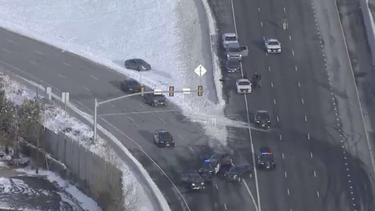 Layton police arrested a man following a shootout with officers on I-15 Wednesday. The man was shot during the exchange and was being treated at a hospital.