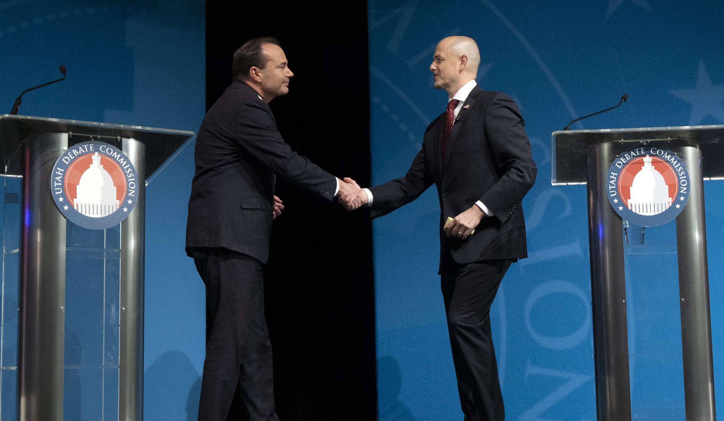 Sen. Mike Lee, R-Utah, and Evan McMullin, U.S. Senate candidate, shake hands at a debate at Utah Valley University in Orem on Oct. 17. A new Deseret News/Hinckley Institute of Politics poll shows nearly half of Utah voters say negative campaigning — which flooded the airwaves, mailboxes and social media for weeks — had no impact on who they supported in the 2022 election.