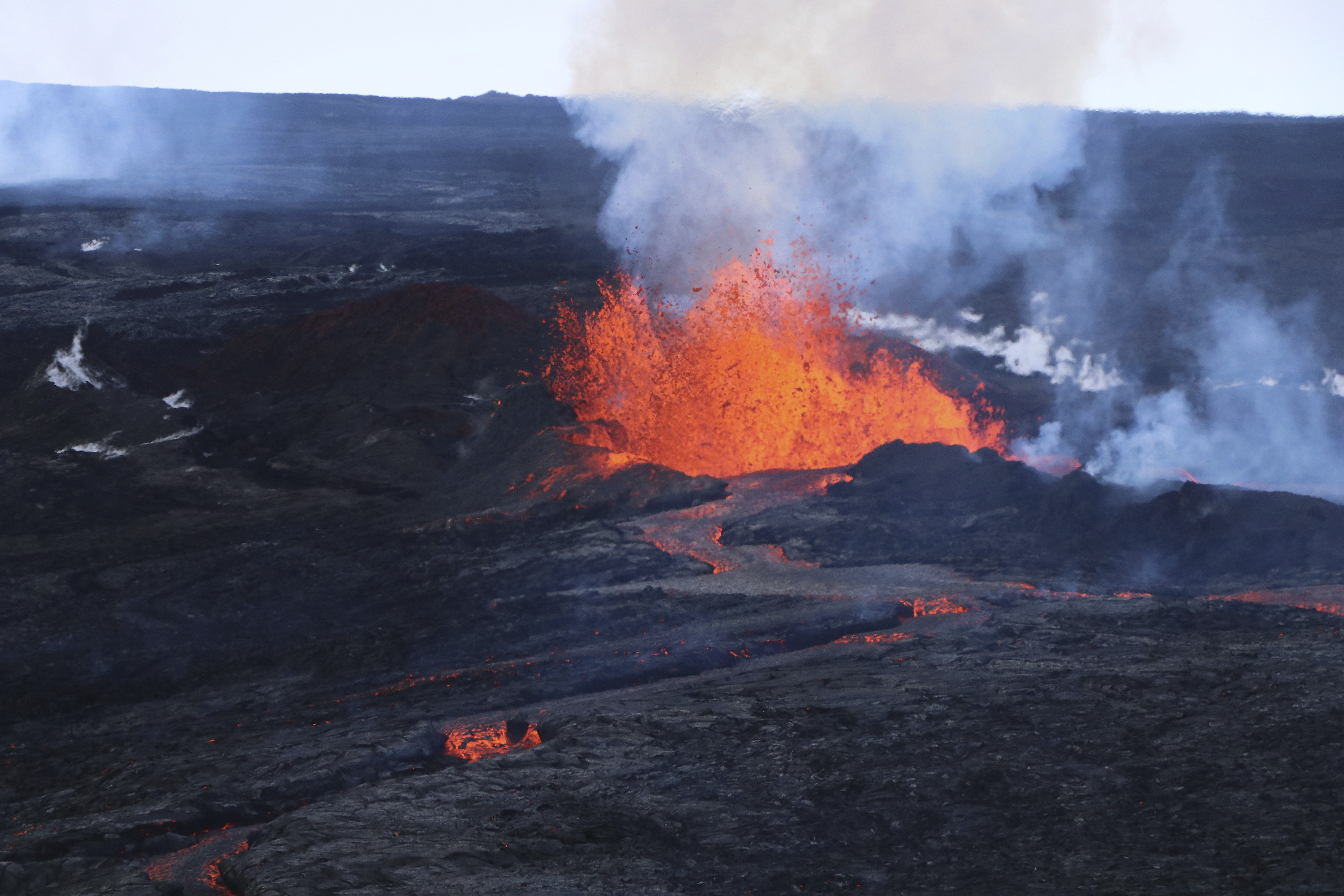 This aerial image shows lava flows on Mauna Loa, the world's largest active volcano, on Wednesday near Hilo, Hawaii. People in Hawaii are asking if anything can be done to stop or divert the flow of lava as molten rock from Mauna Loa volcano inches toward a highway on the Big Island.