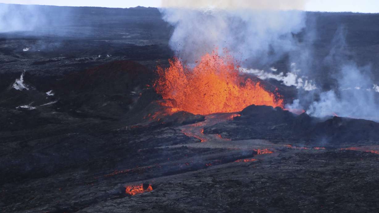This aerial image shows lava flows on Mauna Loa, the world's largest active volcano, on Wednesday near Hilo, Hawaii. People in Hawaii are asking if anything can be done to stop or divert the flow of lava as molten rock from Mauna Loa volcano inches toward a highway on the Big Island.
