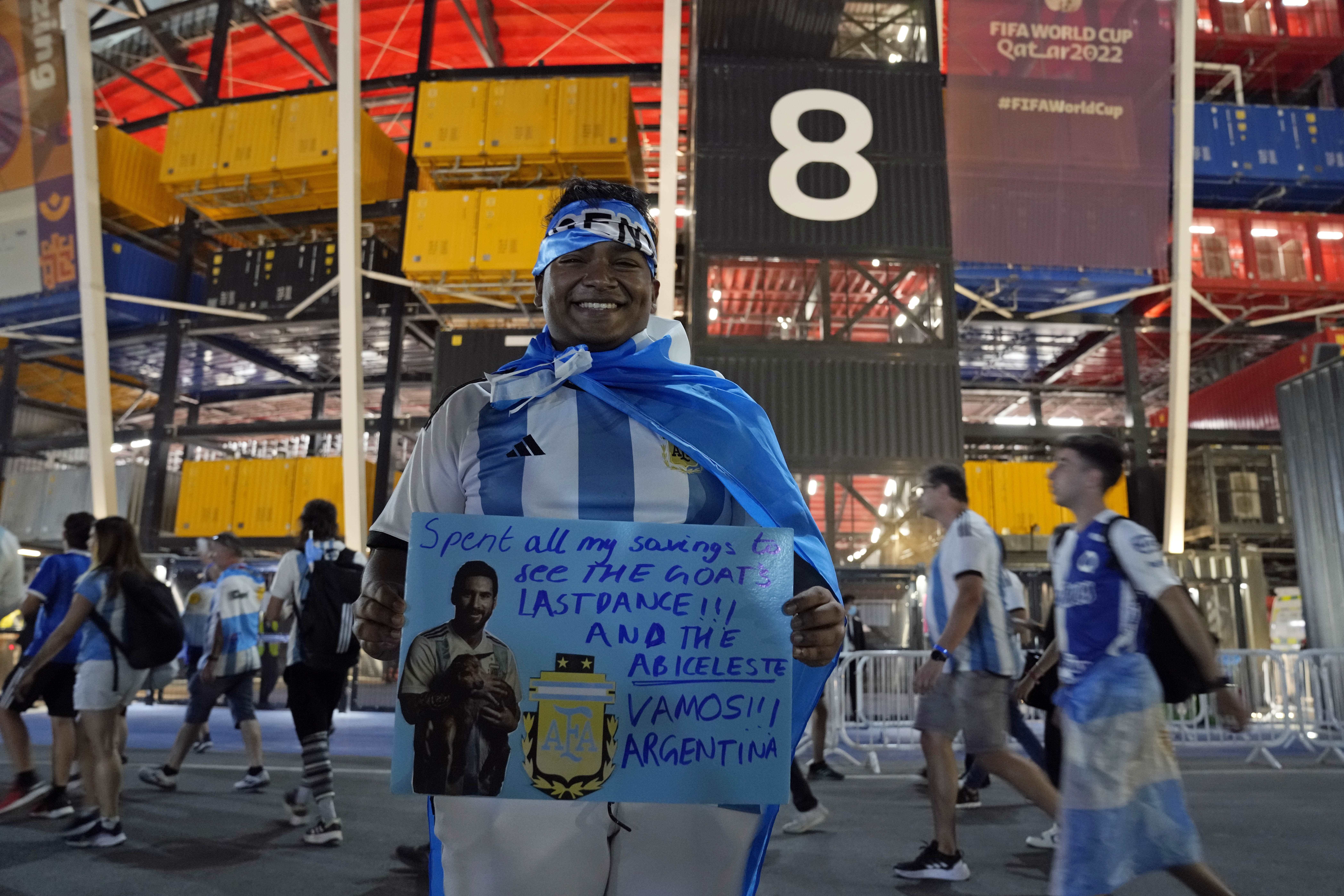 FILE - An Argentina soccer fan from Singapore waits outside before the World Cup group C soccer match between Poland and Argentina at the Stadium 974 in Doha, Qatar, Wednesday, Nov. 30, 2022. 