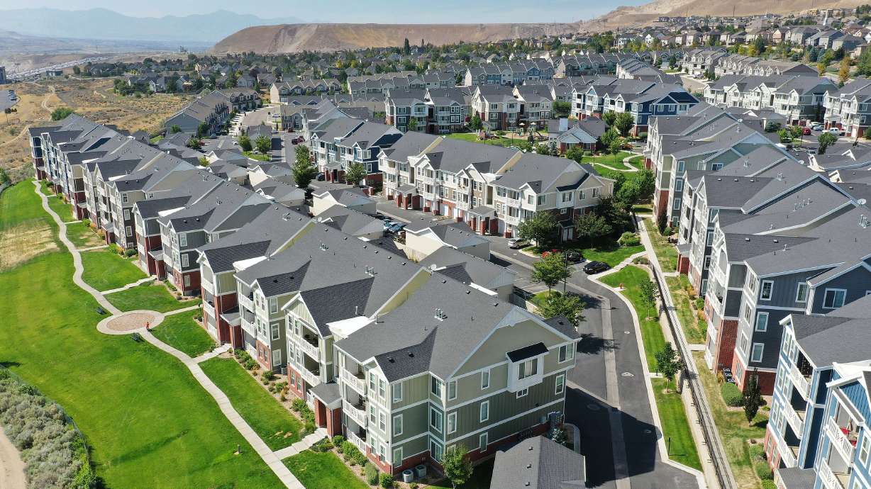 Apartments and townhouses on Traverse Mountain Boulevard in Lehi are pictured on Aug. 11, 2021. The University of Utah Kem C. Gardner Policy Institute issued its 2022 population report Thursday, which points to Utah County as the state's leader in population growth yet again.