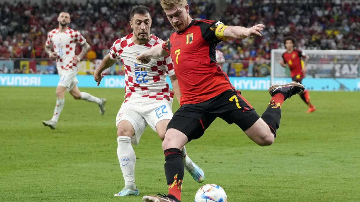 Belgium's Kevin De Bruyne, right, and Croatia's Josip Juranovic, left, fight for the ball during the World Cup group F soccer match between Croatia and Belgium at the Ahmad Bin Ali Stadium in Al Rayyan , Qatar, Thursday, Dec. 1, 2022.