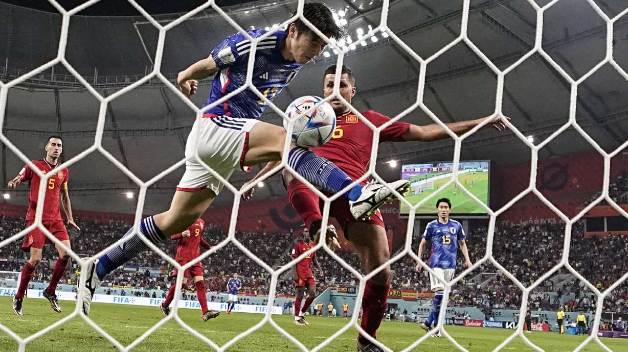 Japan's Ao Tanaka scores his side's second goal during the World Cup group E soccer match between Japan and Spain, at the Khalifa International Stadium in Doha, Qatar, Thursday, Dec. 1, 2022.