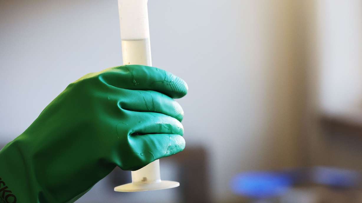 Benjamin Jordan tests a wastewater sample for COVID-19 at Salt Lake City Water Reclamation Facility in Salt Lake City on April 6. Wastewater monitoring for polio is set to increase in the United States, the Centers for Disease Control and Prevention announced this week.