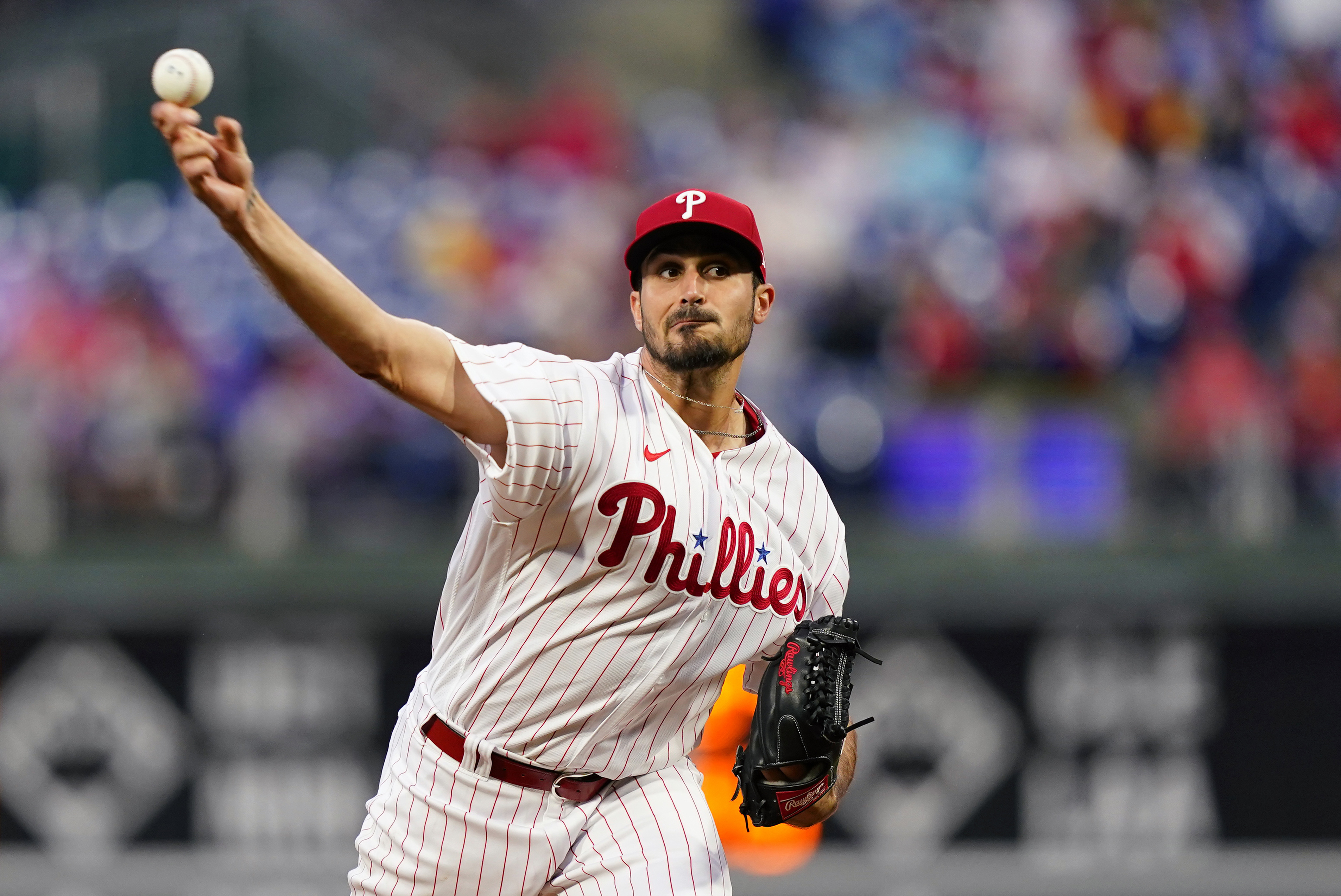 FILE - Philadelphia Phillies' Zach Eflin pitches during the first inning of the team's baseball game against the Colorado Rockies, April 26, 2022, in Philadelphia. Eflin has agreed to join the Tampa Bay Rays on a three-year, $40 million contract that’s the largest the club has ever awarded in free agency, a person familiar with the deal told The Associated Press. 