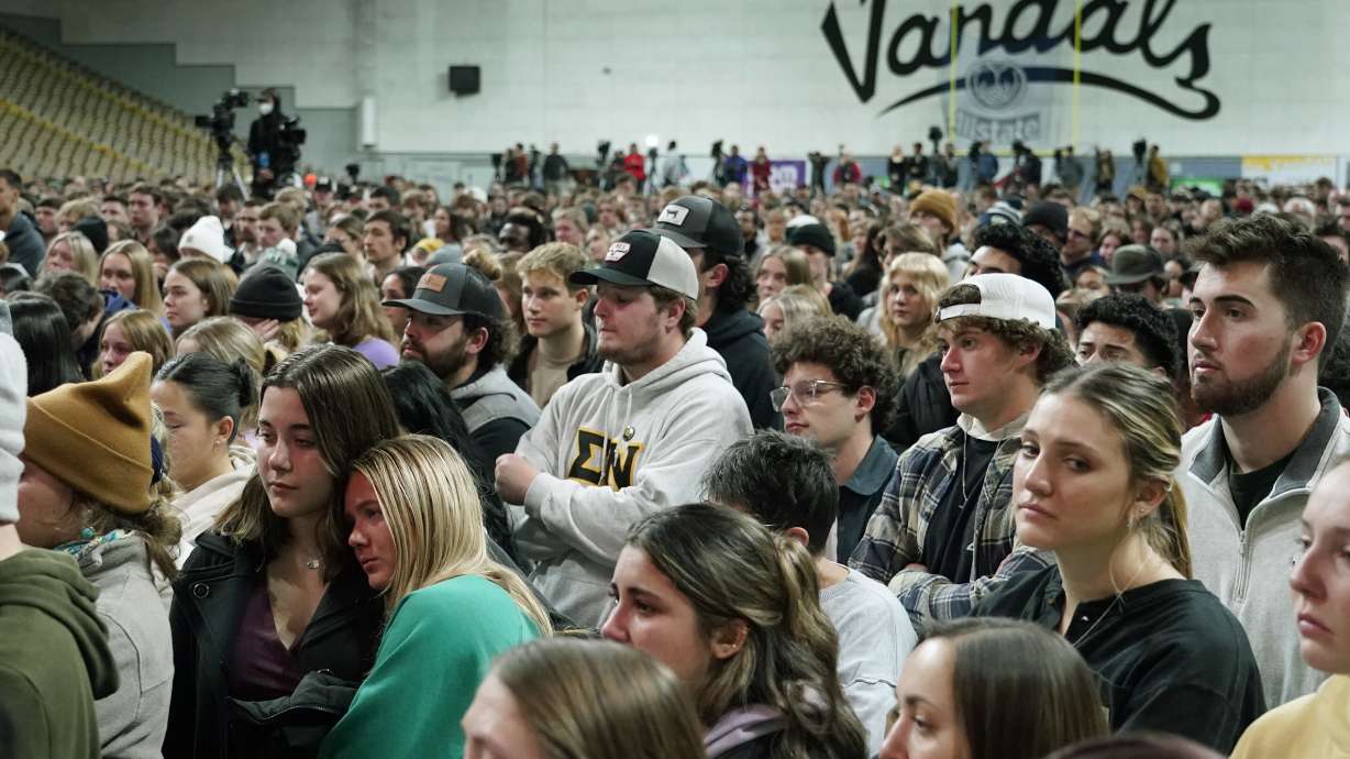 As many University of Idaho students returned to campus this week, the police investigation into the stabbing deaths of four of their peers continued but not without confusion over a key case detail People are seen here at a vigil for the four victims.