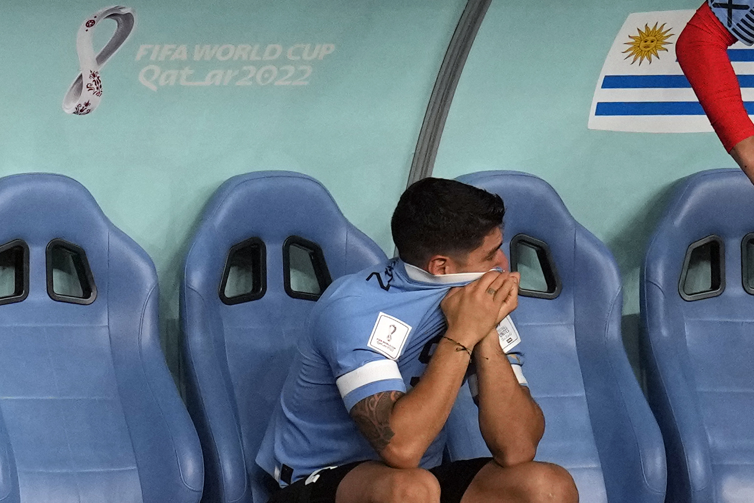 Uruguay's Luis Suarez sits on the bench during the World Cup group H soccer match between Ghana and Uruguay, at the Al Janoub Stadium in Al Wakrah, Qatar, Friday, Dec. 2, 2022. 