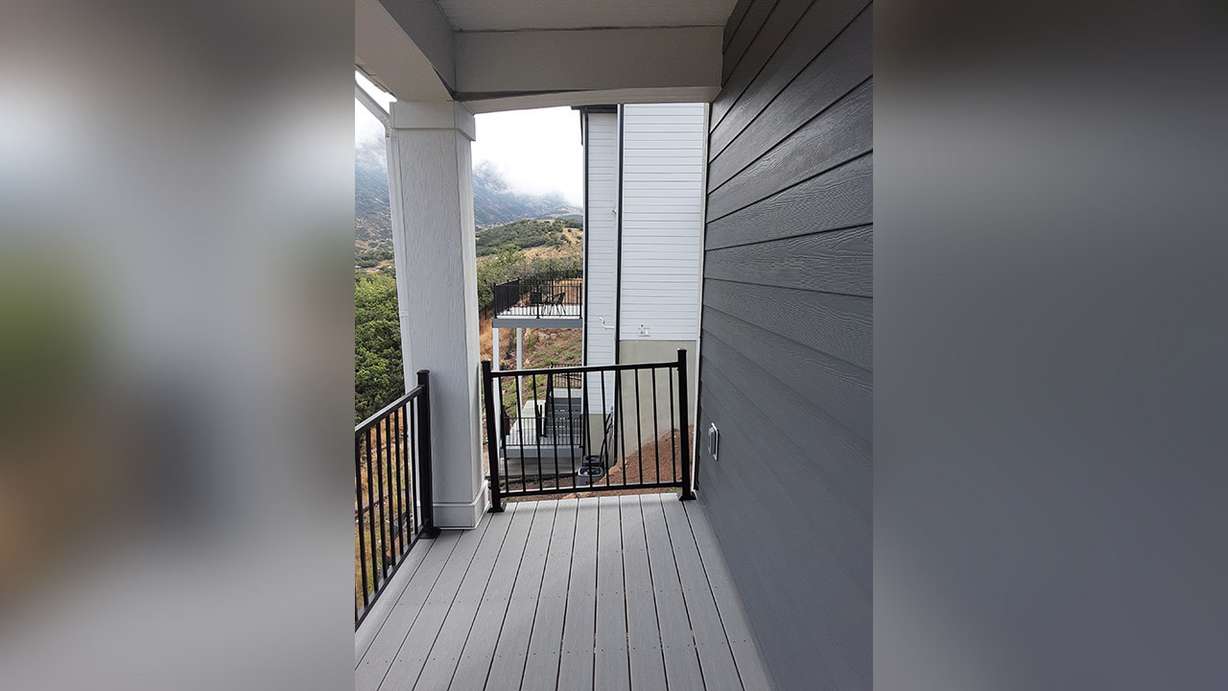 A gap is shown between a railing and the home of Eric and Carole Kamradt in Draper.