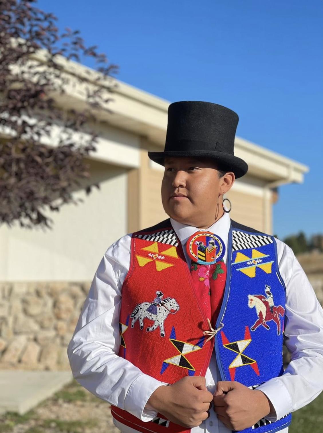 Taylor "Cheíí" Begay poses for a photo in his trademark top hat. Begay pulled inspiration from a number of Indigenous leaders to help develop his own brand.