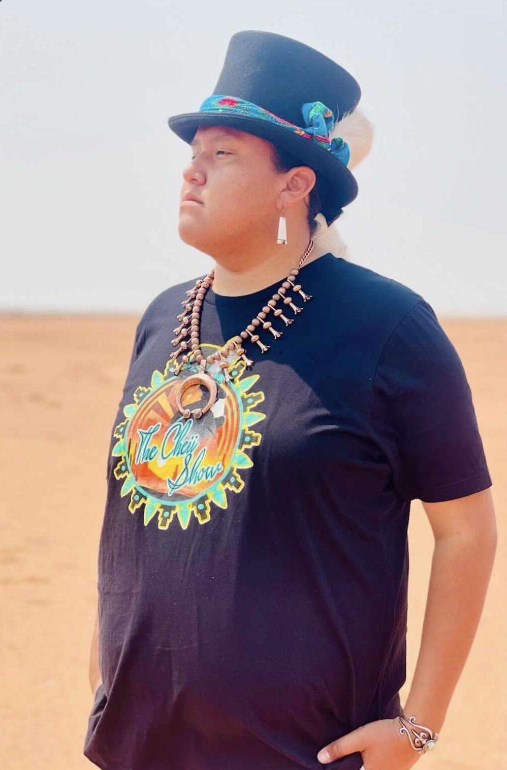Taylor "Cheíí" Begay poses for a photo wearing some "The Cheíí Show" merchandise.