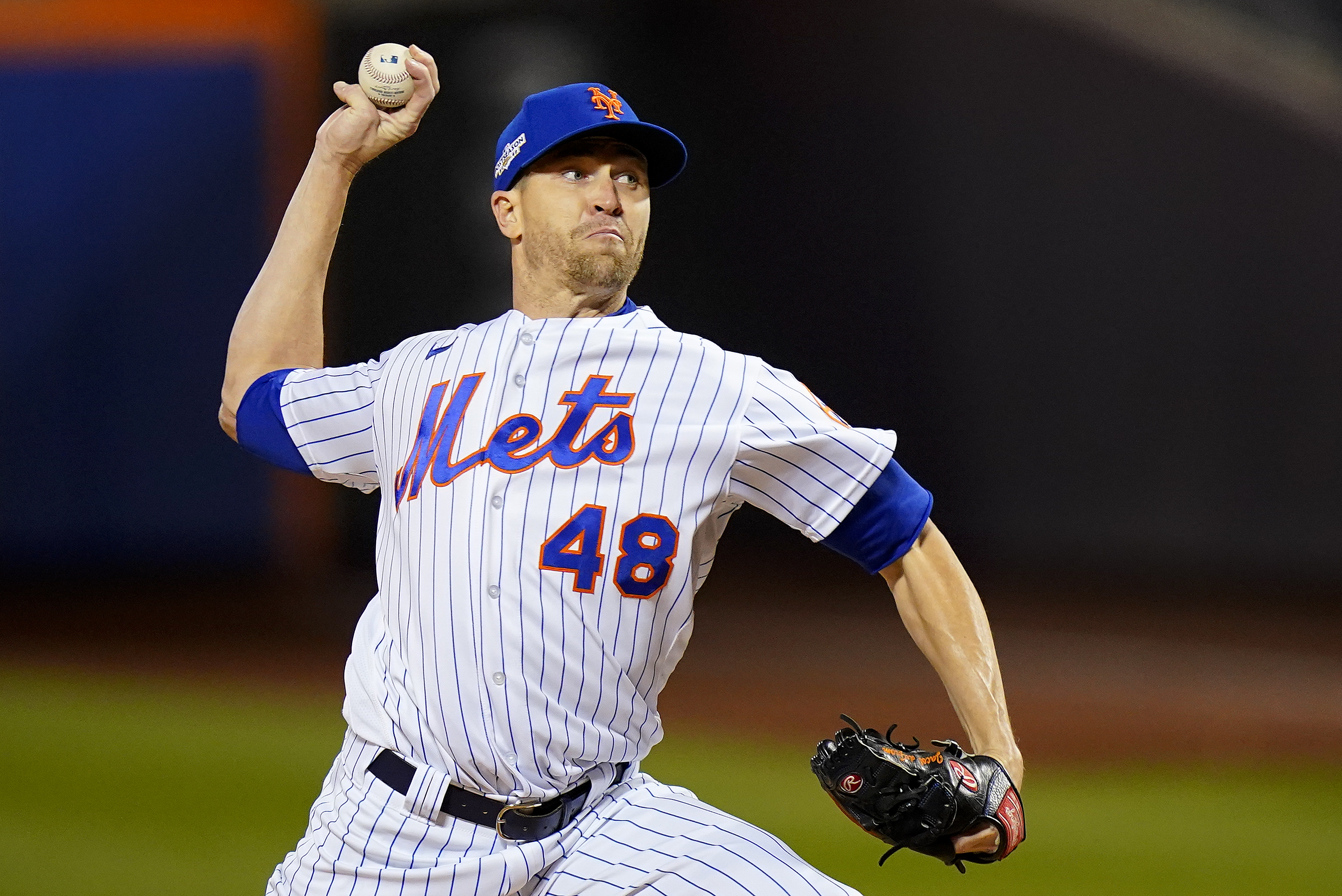 FILE - New York Mets starting pitcher Jacob deGrom delivers against the San Diego Padres during the first inning of Game 2 of a National League wild-card baseball playoff series Oct. 8, 2022, in New York. Free-agent ace deGrom and the Texas Rangers agreed to a five-year contract Friday, Dec. 2, 2022. 