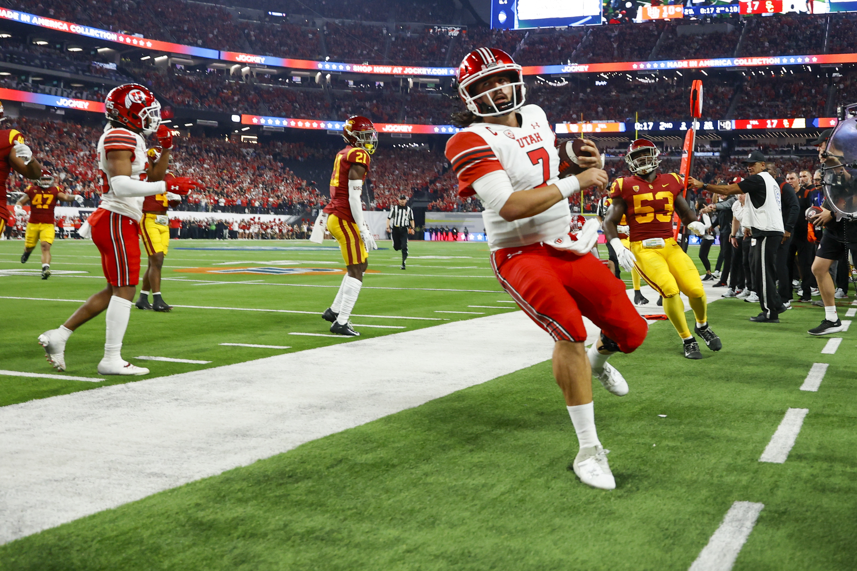 Utah Utes QB Cameron Rising runs out of bounds while playing the USC Trojans in the Pac-12 championship at Allegiant Stadium in Las Vegas on Friday, Dec. 2, 2022.