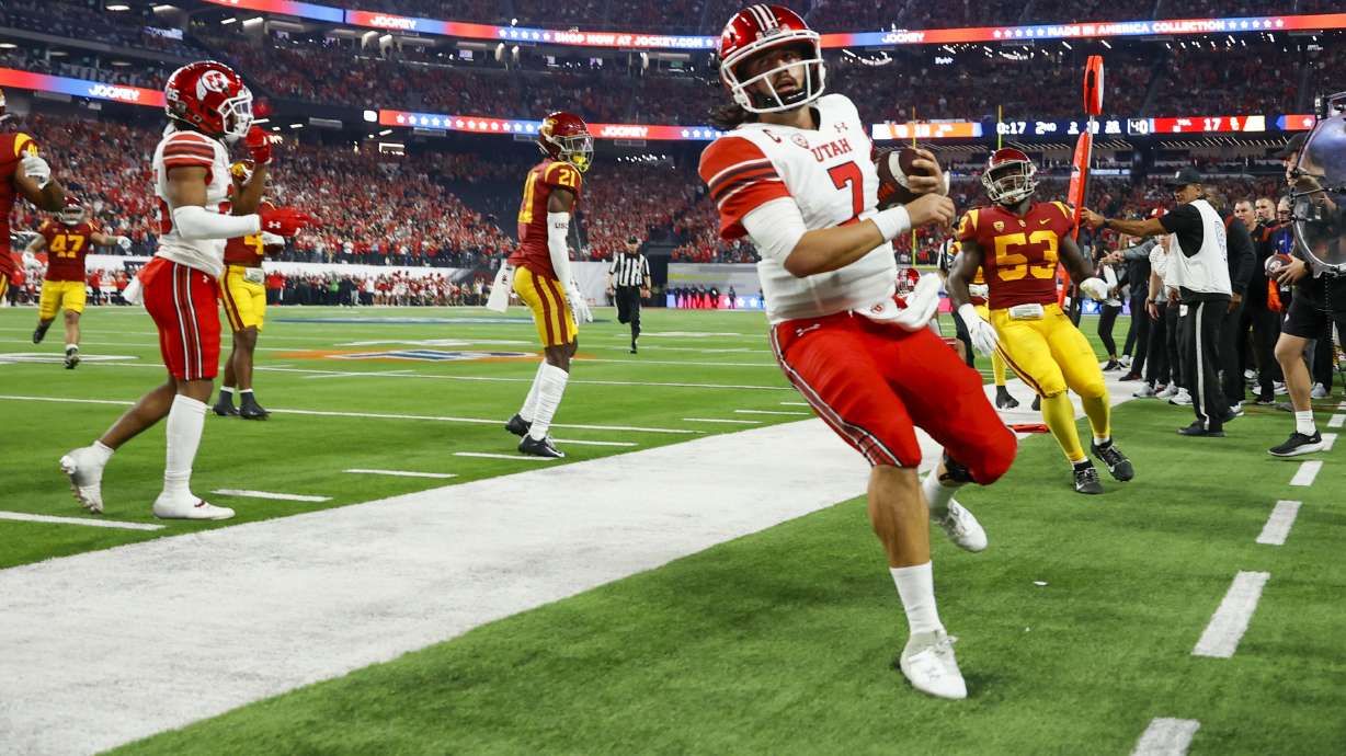 Utah Utes QB Cameron Rising runs out of bounds while playing the USC Trojans in the Pac-12 championship at Allegiant Stadium in Las Vegas on Friday, Dec. 2, 2022.