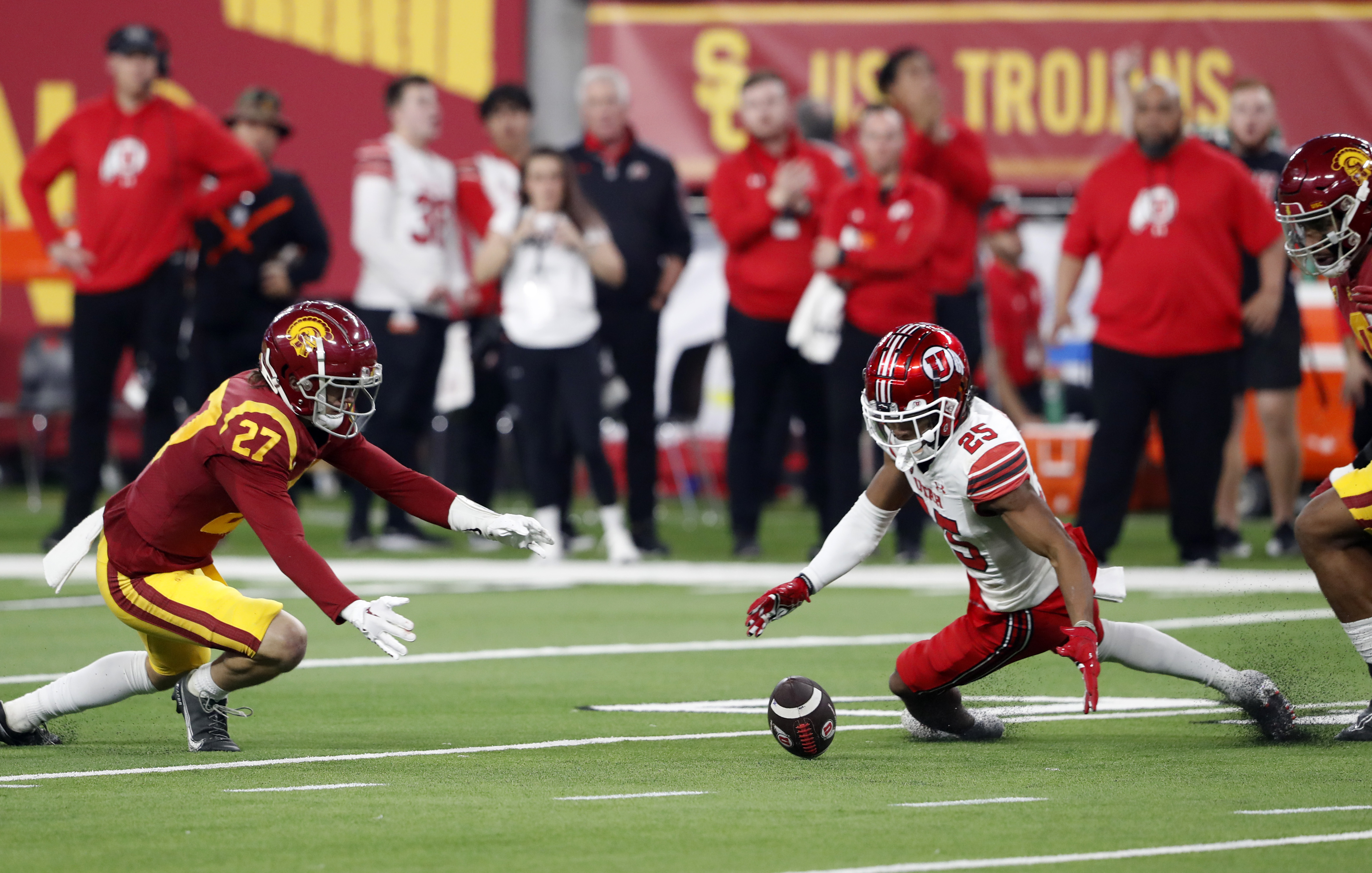Utah wide receiver Jaylen Dixon (25) fumbles the ball during the first half of the Pac-12 Conference championship NCAA college football game against Southern California, Friday, Dec. 2, 2022, in Las Vegas. Southern California defensive back Bryson Shaw (27) recovered the fumble. 