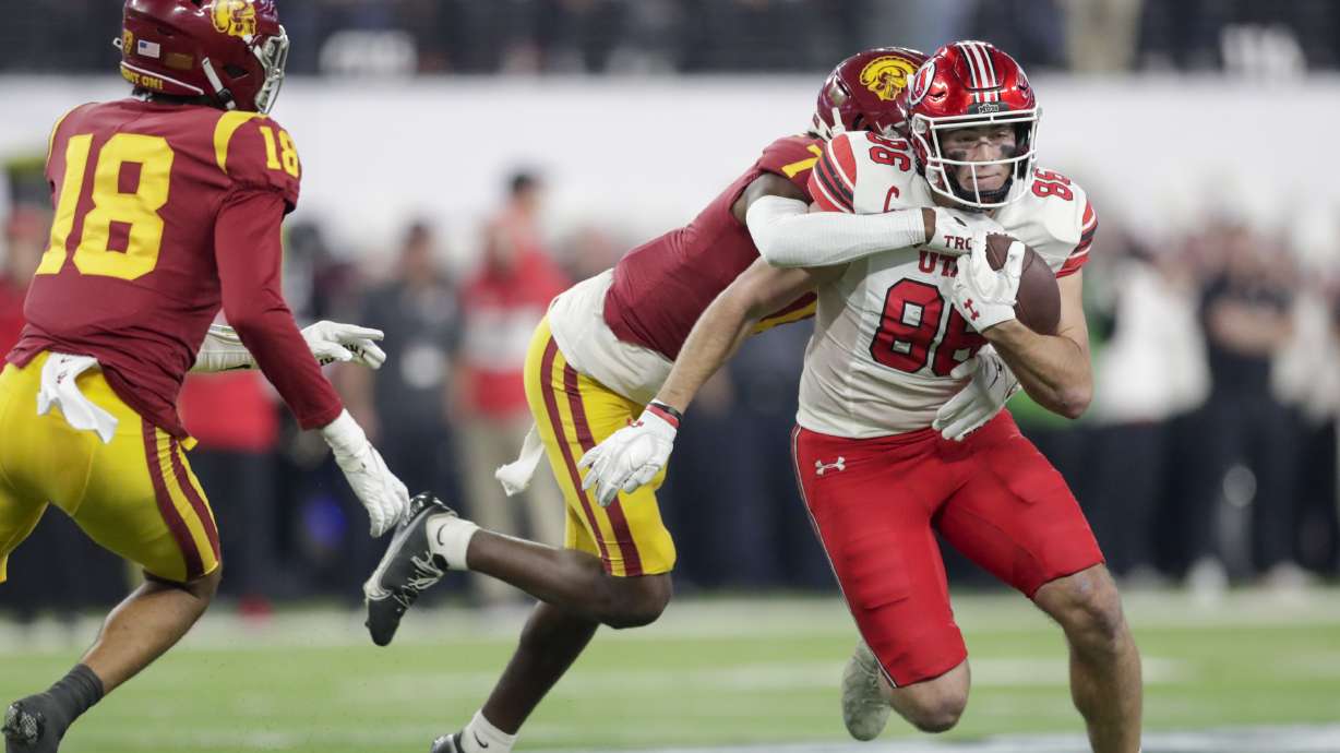 Utah Utes Dalton Kincaid runs with the ball while playing the USC Trojans in the Pac-12 championship at the Allegiant Stadium in Las Vegas on Friday, Dec. 2, 2022. The Utes won 47-24.