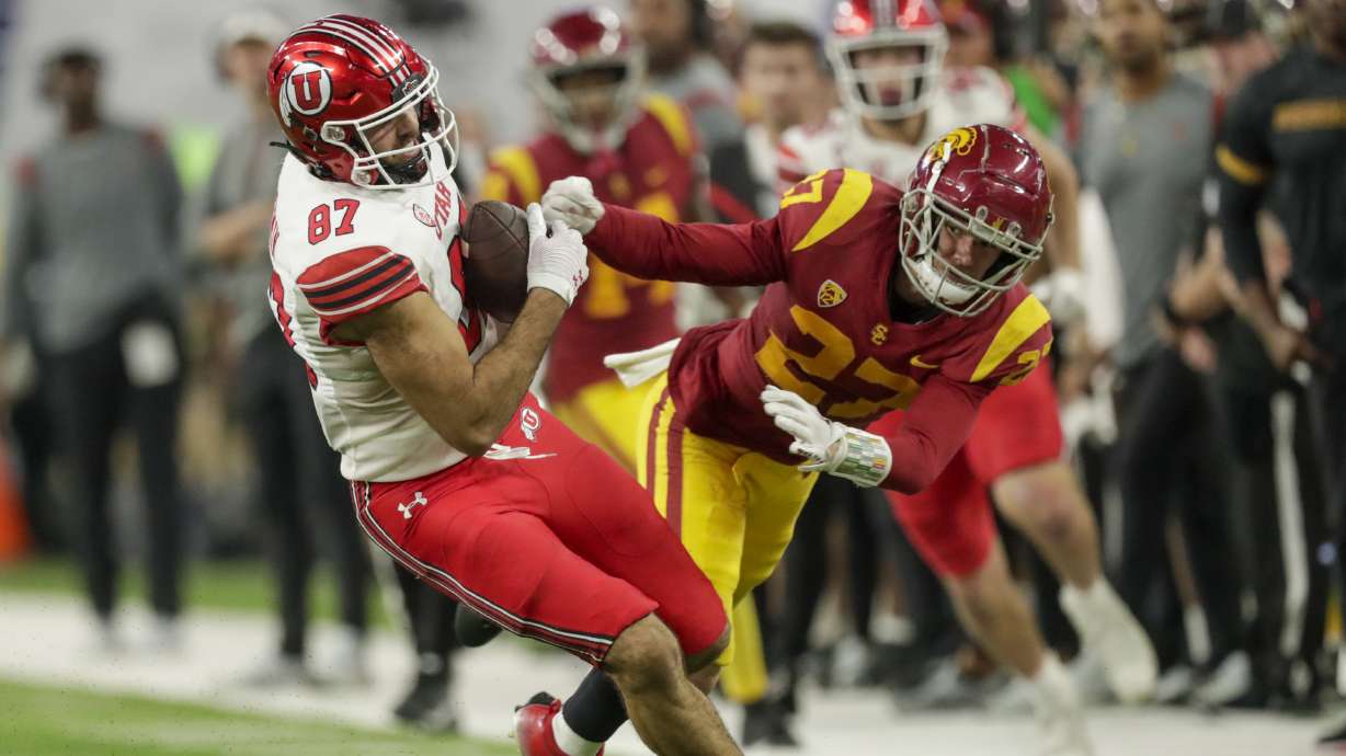 Utah Utes Thomas Yassmin shakes off a tackle from USC Trojans Bryson Shaw during the Pac-12 Championship at the Allegiant Stadium in Las Vegas on Friday, Dec. 2, 2022. The Utes won 47-24.