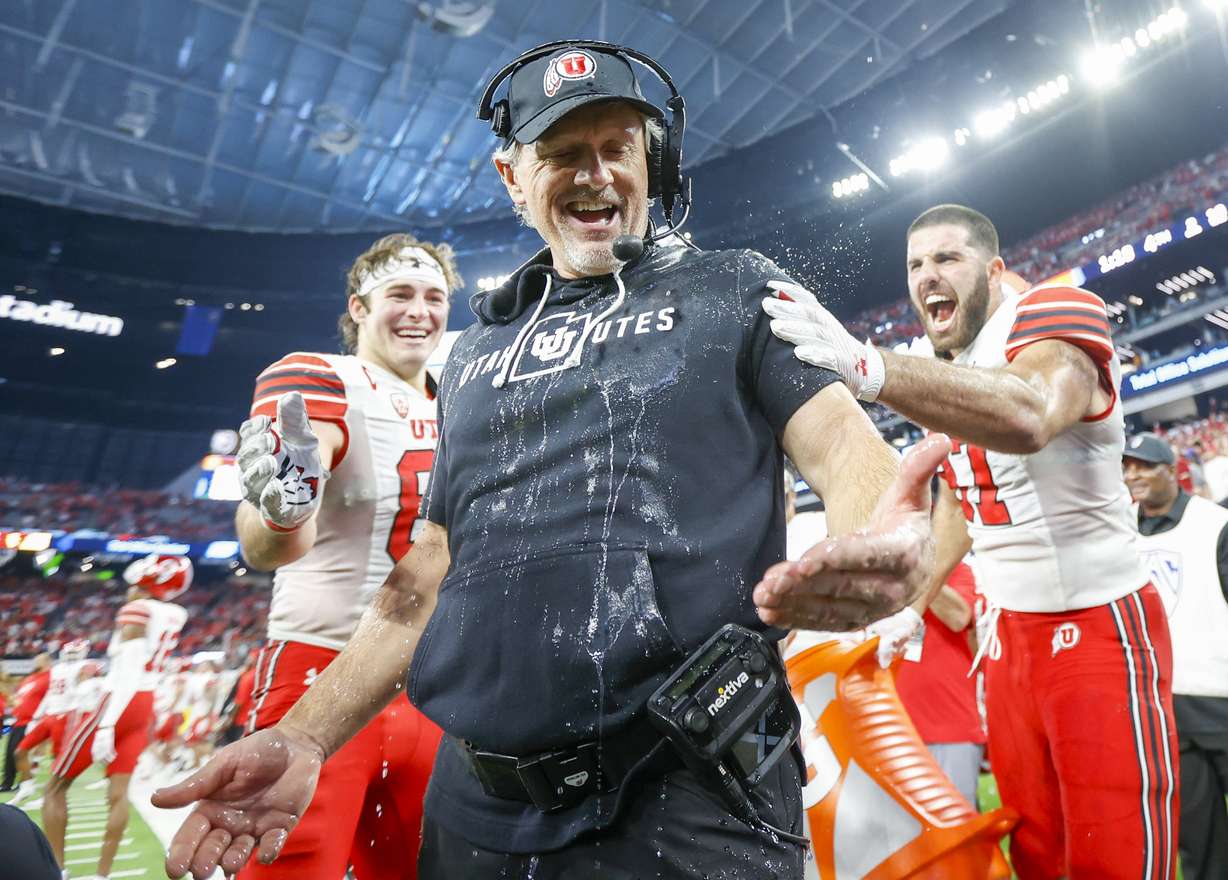 Utah Utes head coach Kyle Whittingham is doused in celebration before beating the USC Trojans in the Pac-12 Championship at the Allegiant Stadium in Las Vegas on Friday, Dec. 2, 2022. The Utes won 47-24.
