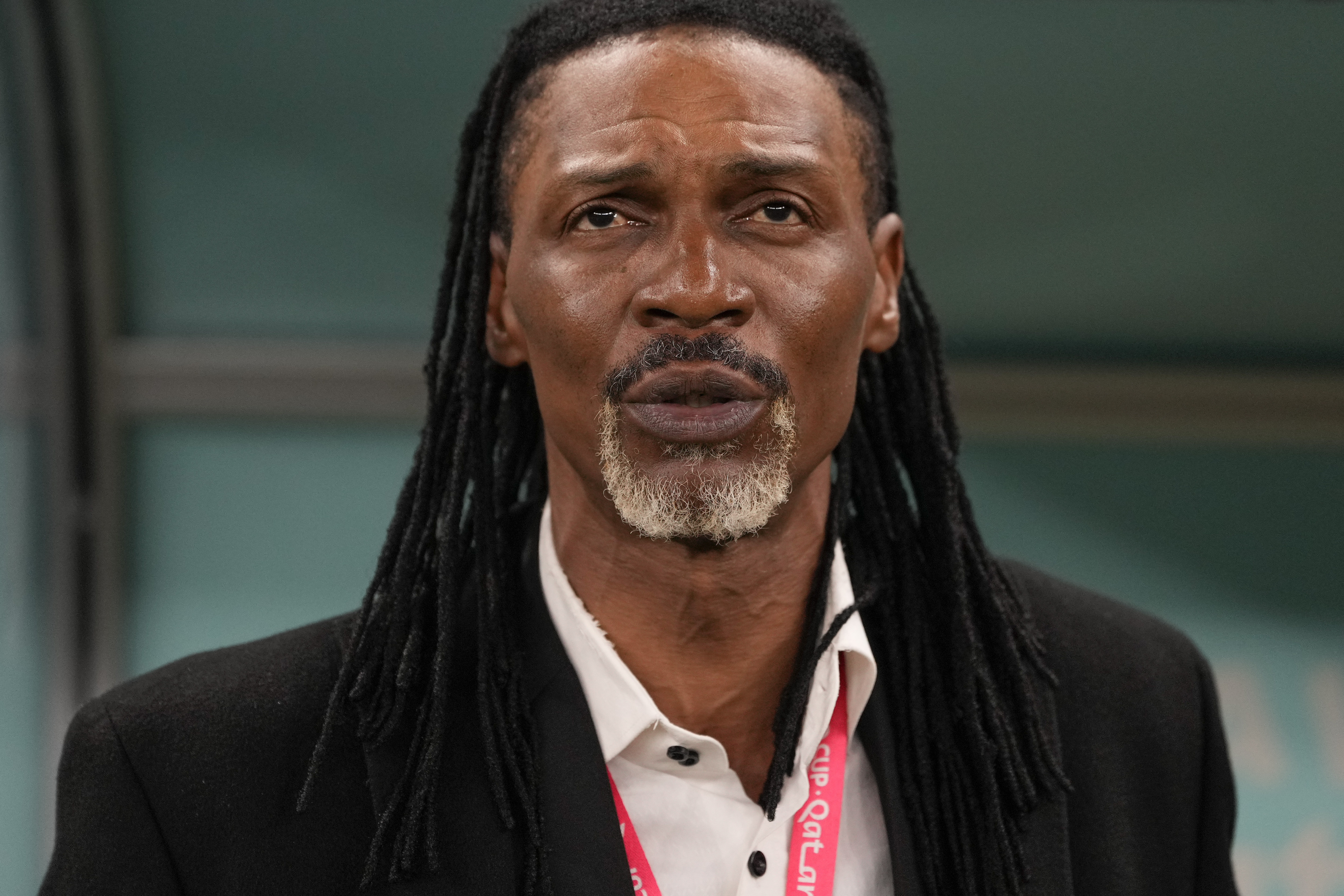 Cameroon's head coach Rigobert Song listen to national anthem prior the World Cup group G soccer match between Cameroon and Brazil, at the Lusail Stadium in Lusail, Qatar, Friday, Dec. 2, 2022.