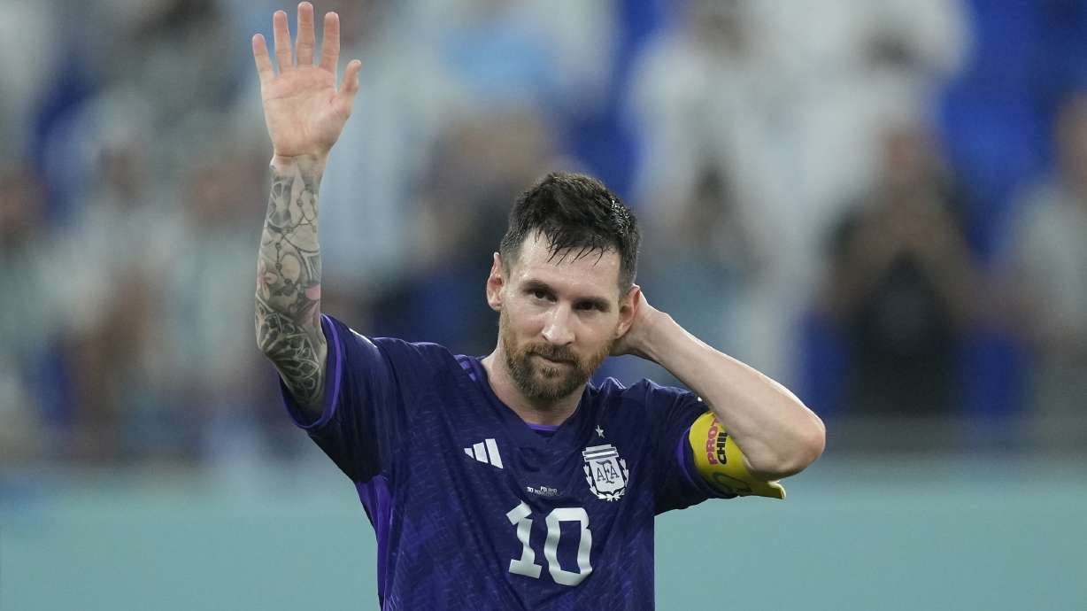Argentina's Lionel Messi waves to the fans after the World Cup group C soccer match between Poland and Argentina at the Stadium 974 in Doha, Qatar, Wednesday, Nov. 30, 2022. Argentina won 2-0.