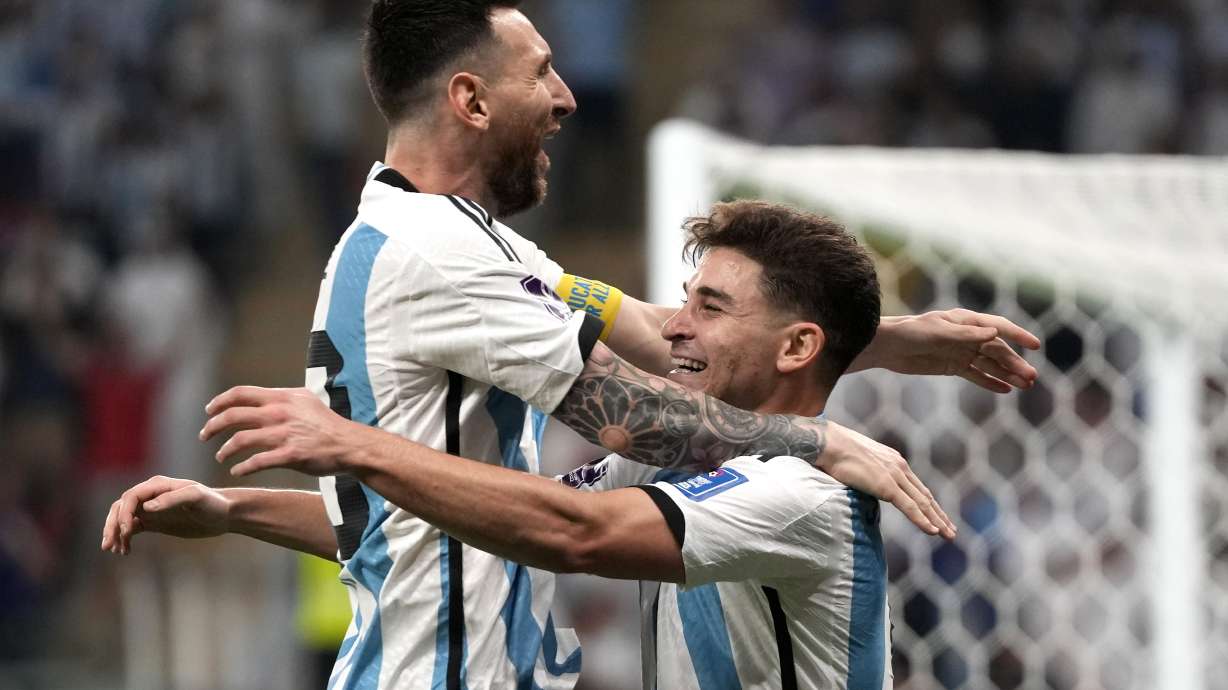 Argentina's Julian Alvarez, right, and Lionel Messi, left, celebrate their side's second goal during the World Cup round of 16 soccer match between Argentina and Australia at the Ahmad Bin Ali Stadium in Doha, Qatar, Saturday, Dec. 3, 2022.