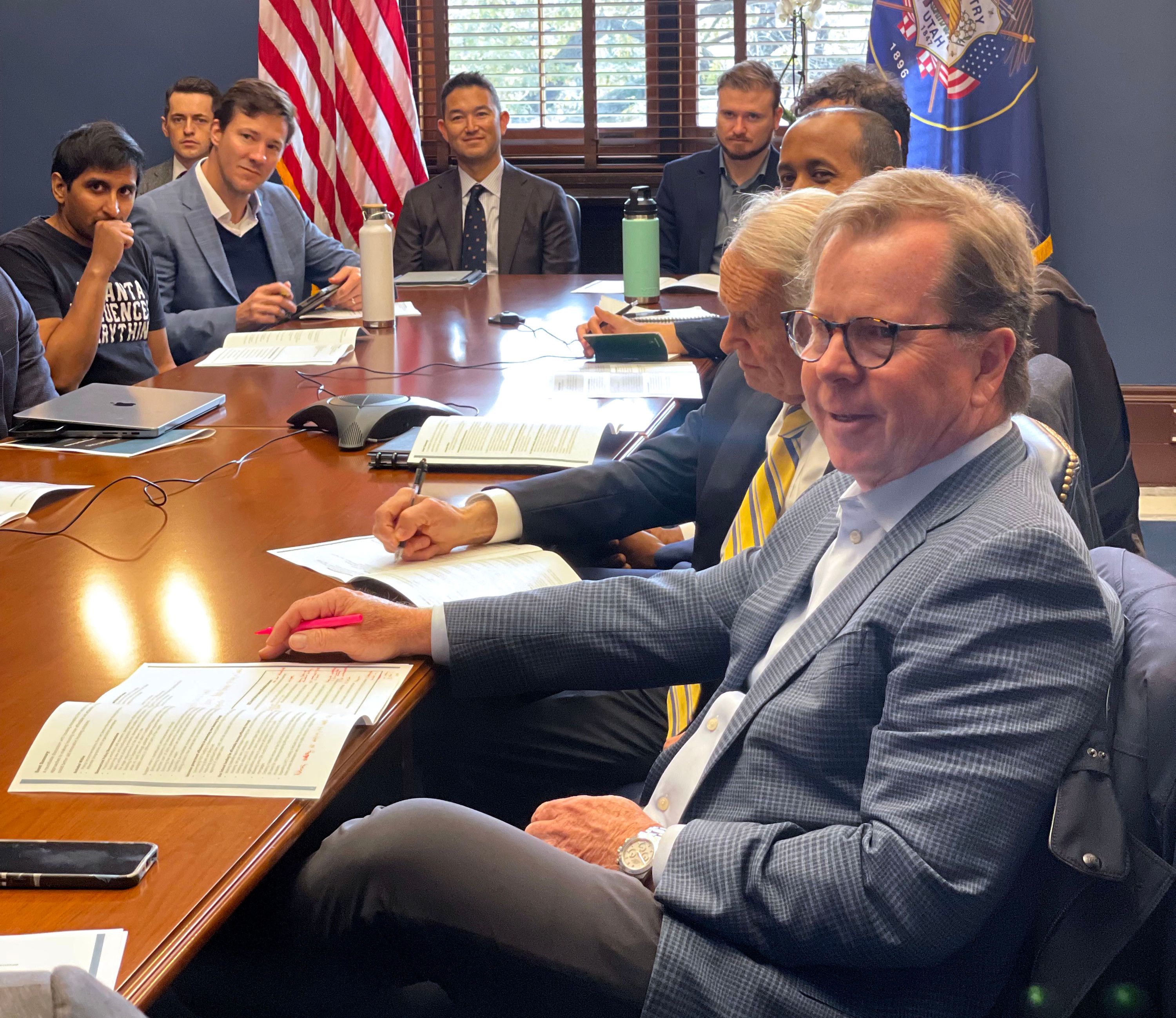 Clark Ivory, CEO of Ivory Homes, speaks with Utah GOP Sen. Mitt Romney’s staff during a visit to Washington, D.C., Nov. 15.