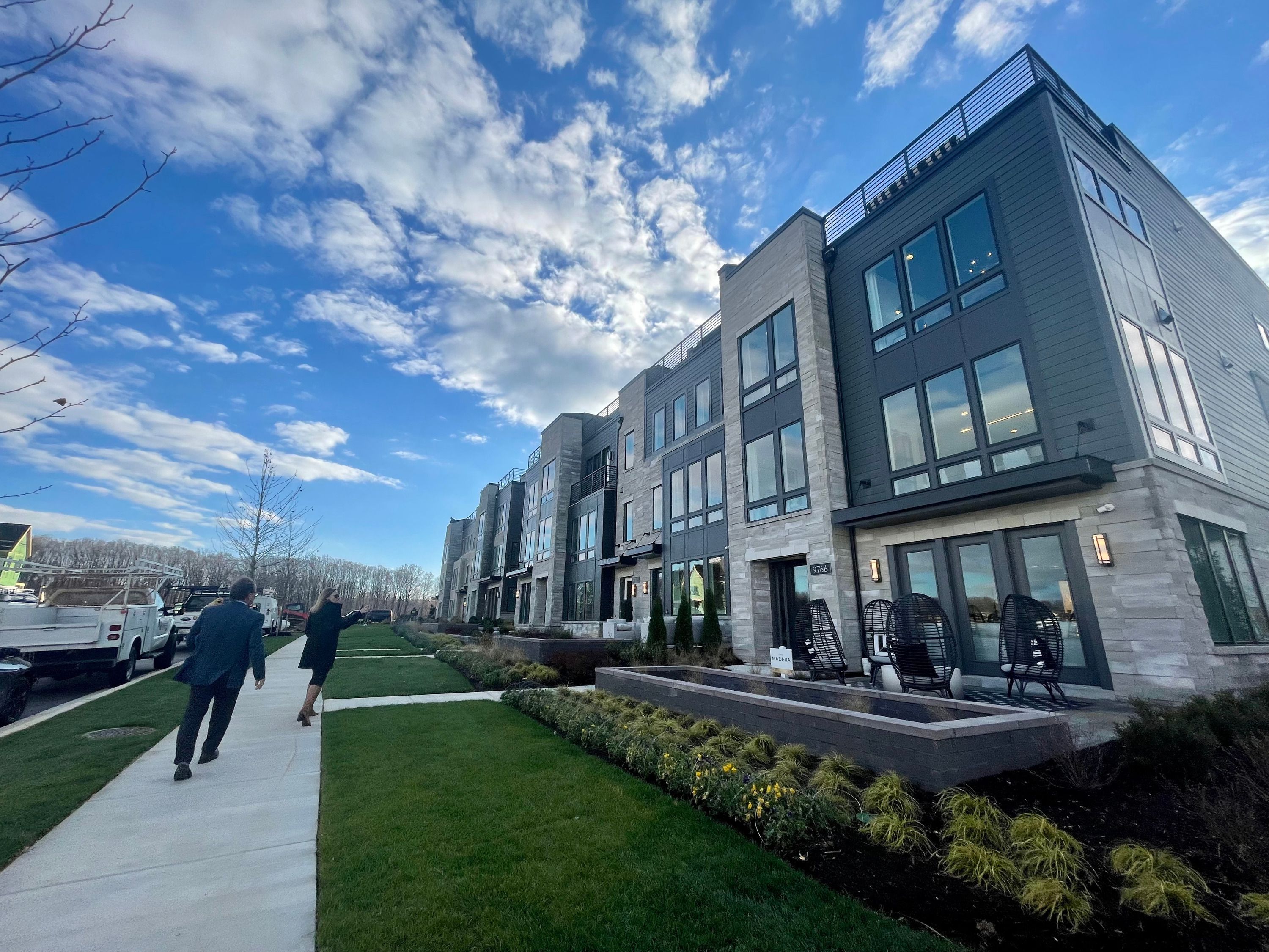 Clark Ivory, CEO of Ivory Homes, left, and Jenna Louie, director of strategy and operations at Ivory Innovations, tour new townhouses in Washington, D.C., on Nov. 16.