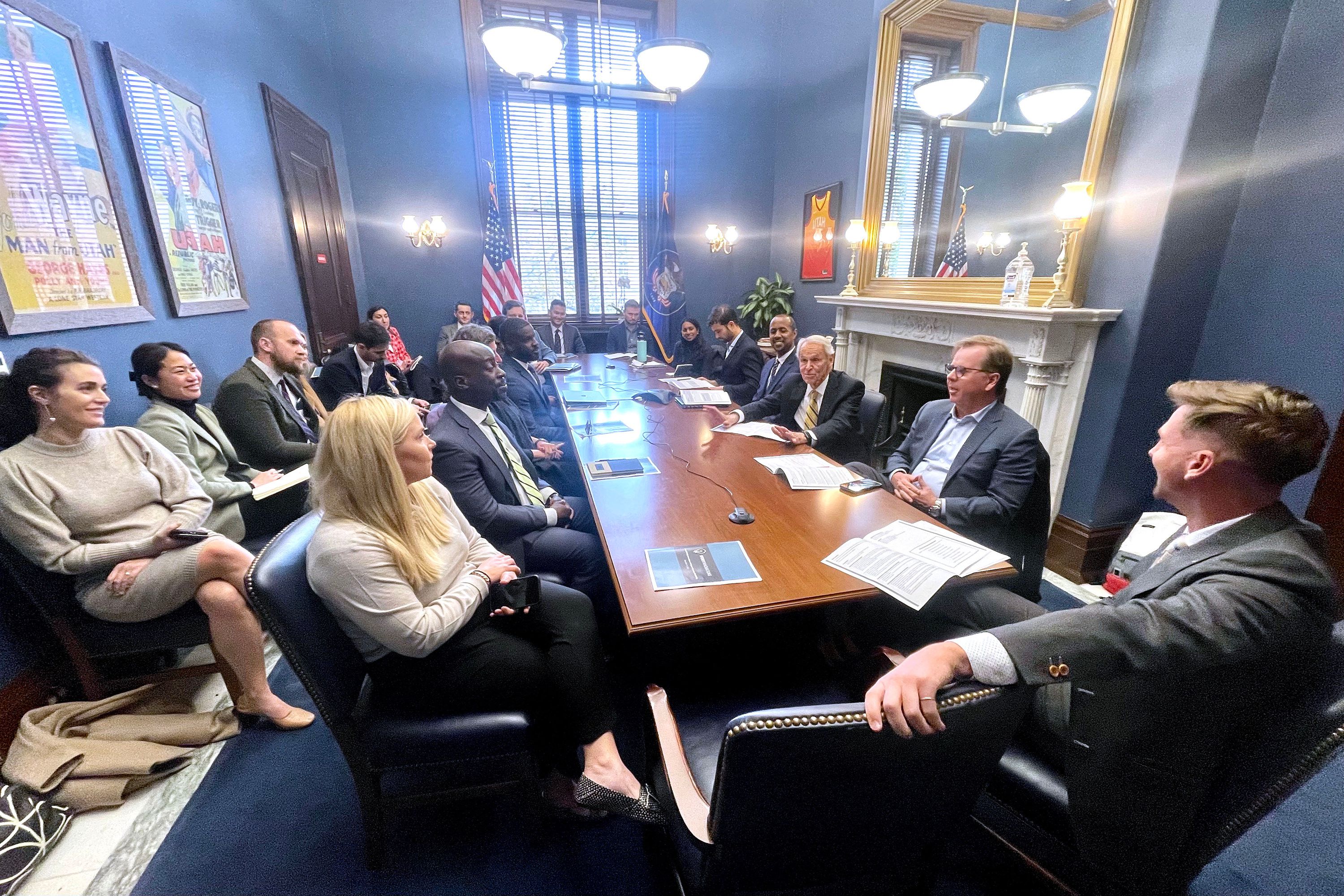 Abby Ivory, front center, managing director of Ivory Innovations, and Clark Ivory, second from right, CEO of Ivory Homes, speak with Utah GOP Sen. Mitt Romney’s staff during a visit to Washington, D.C., Nov. 16.
