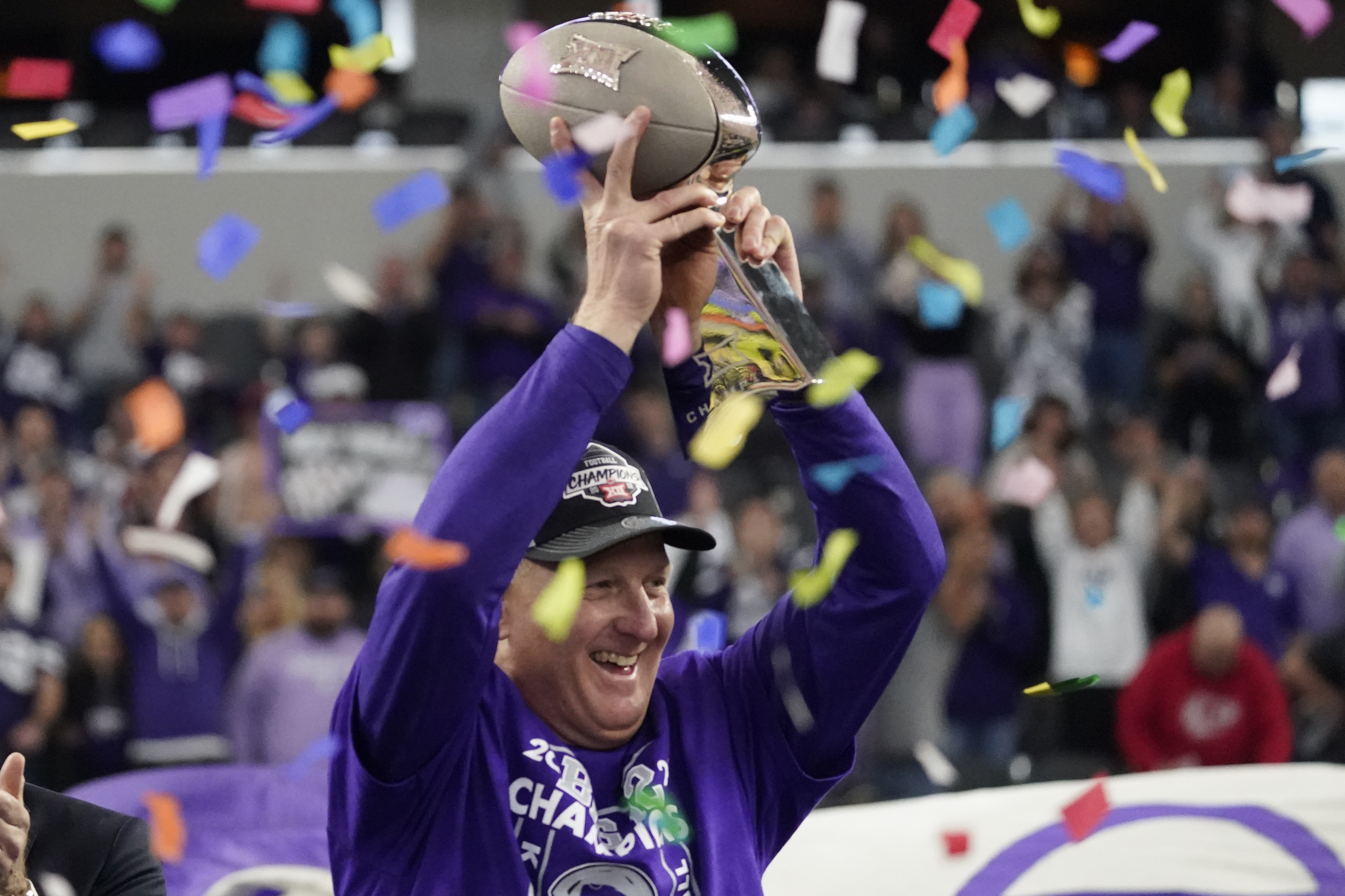 Kansas State head coach Chris Klieman holds the trophy after Kansas State defeated TCU in the Big 12 Conference championship NCAA college football game, Saturday, Dec. 3, 2022, in Arlington, Texas.