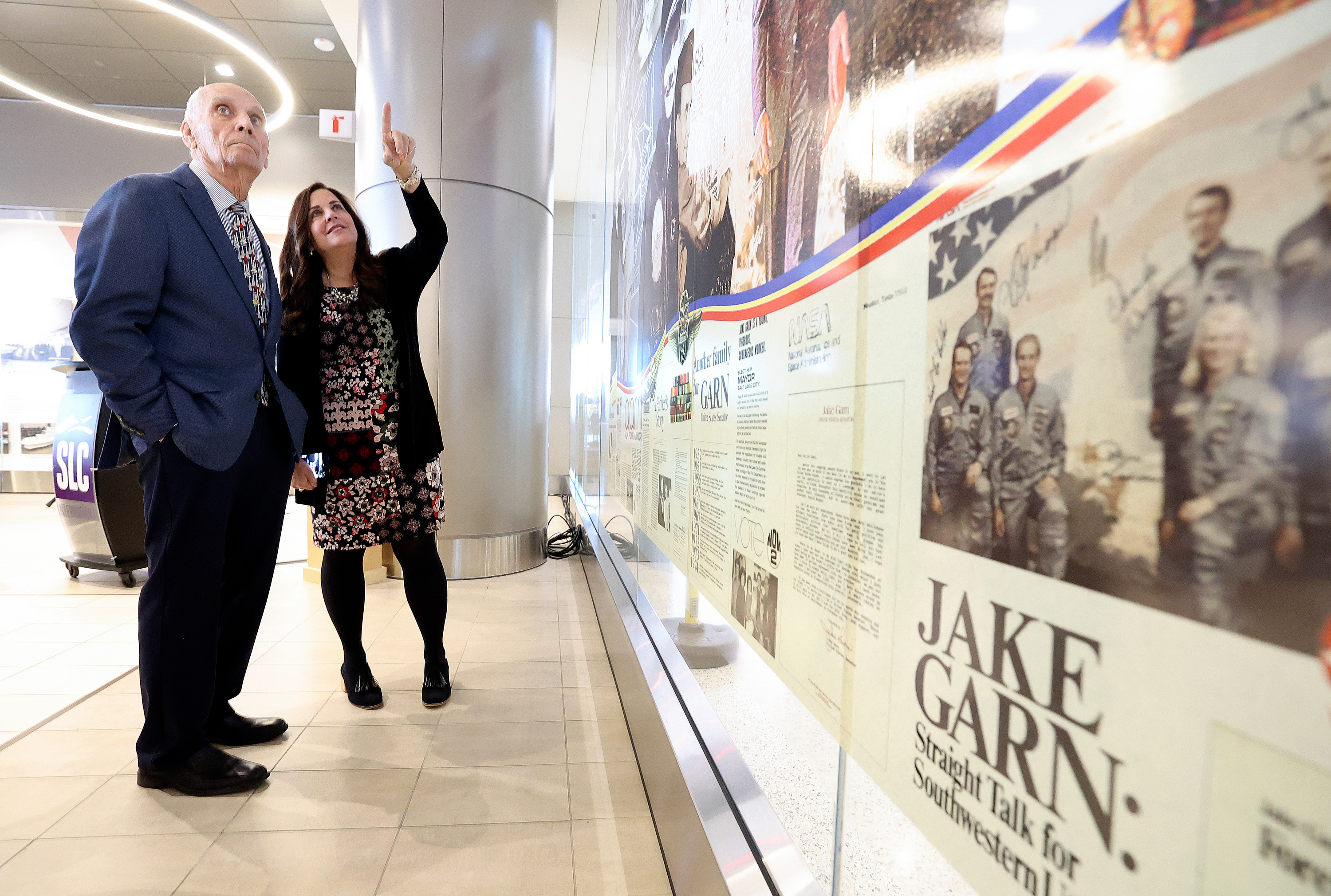 Retired U.S. Sen. Jake Garn, who is also Utah’s first astronaut, and his daughter Ellen Garn look at an art installation honoring him, by Gordon Huether, after the piece was unveiled at the Salt Lake City International Airport greeting room in Salt Lake City on Saturday.